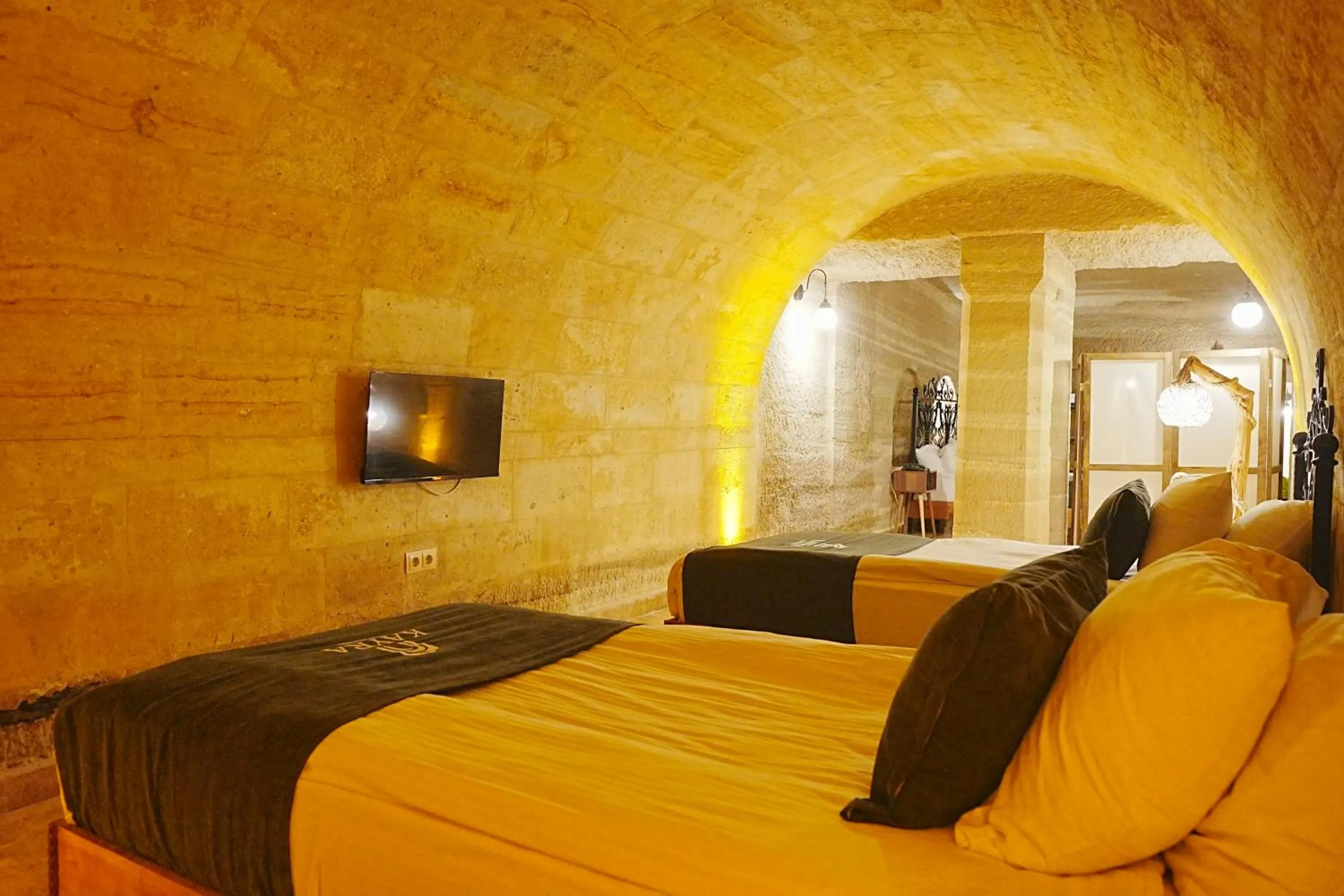 Bed in Kayra Cave Suites
