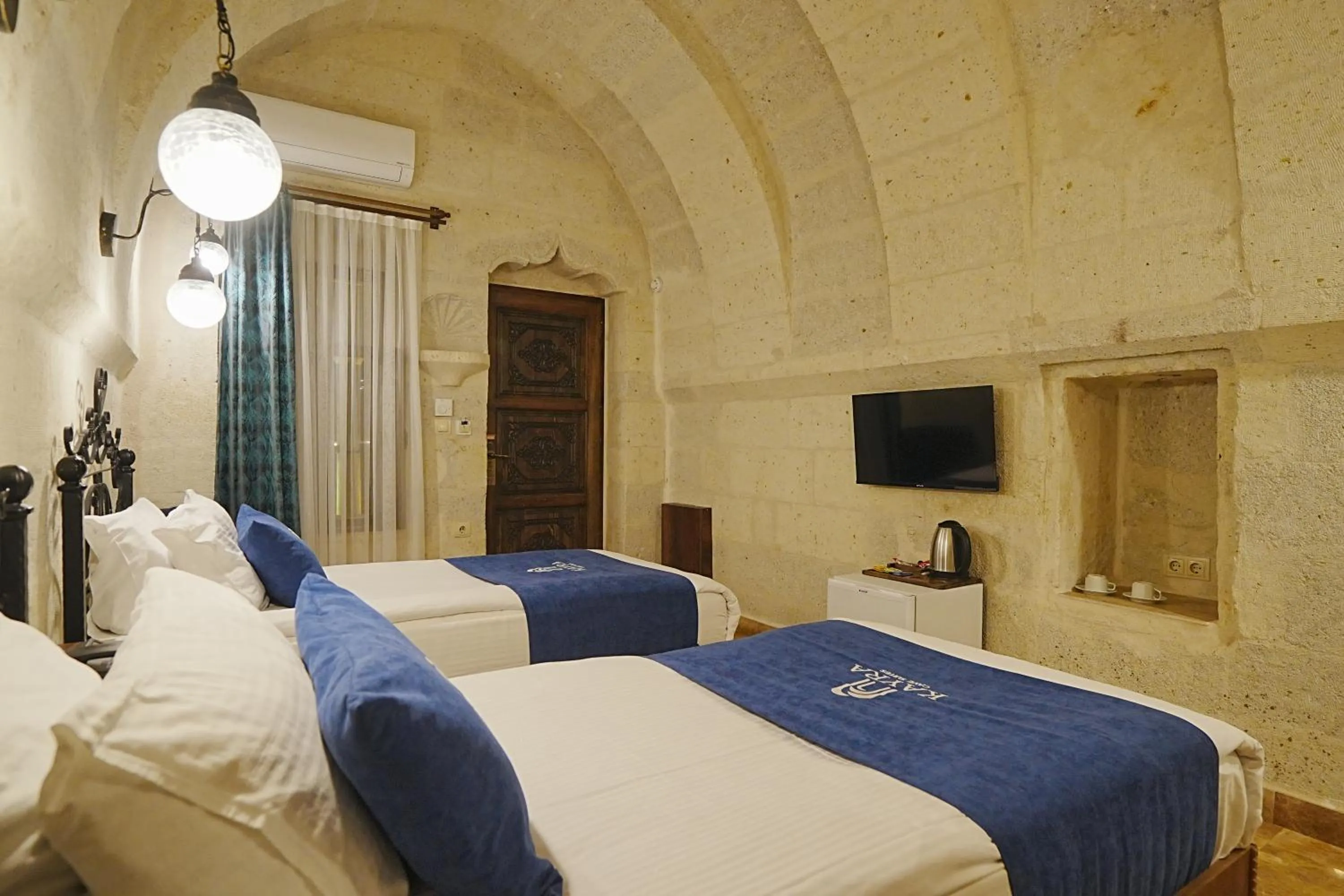 Bed in Kayra Cave Suites