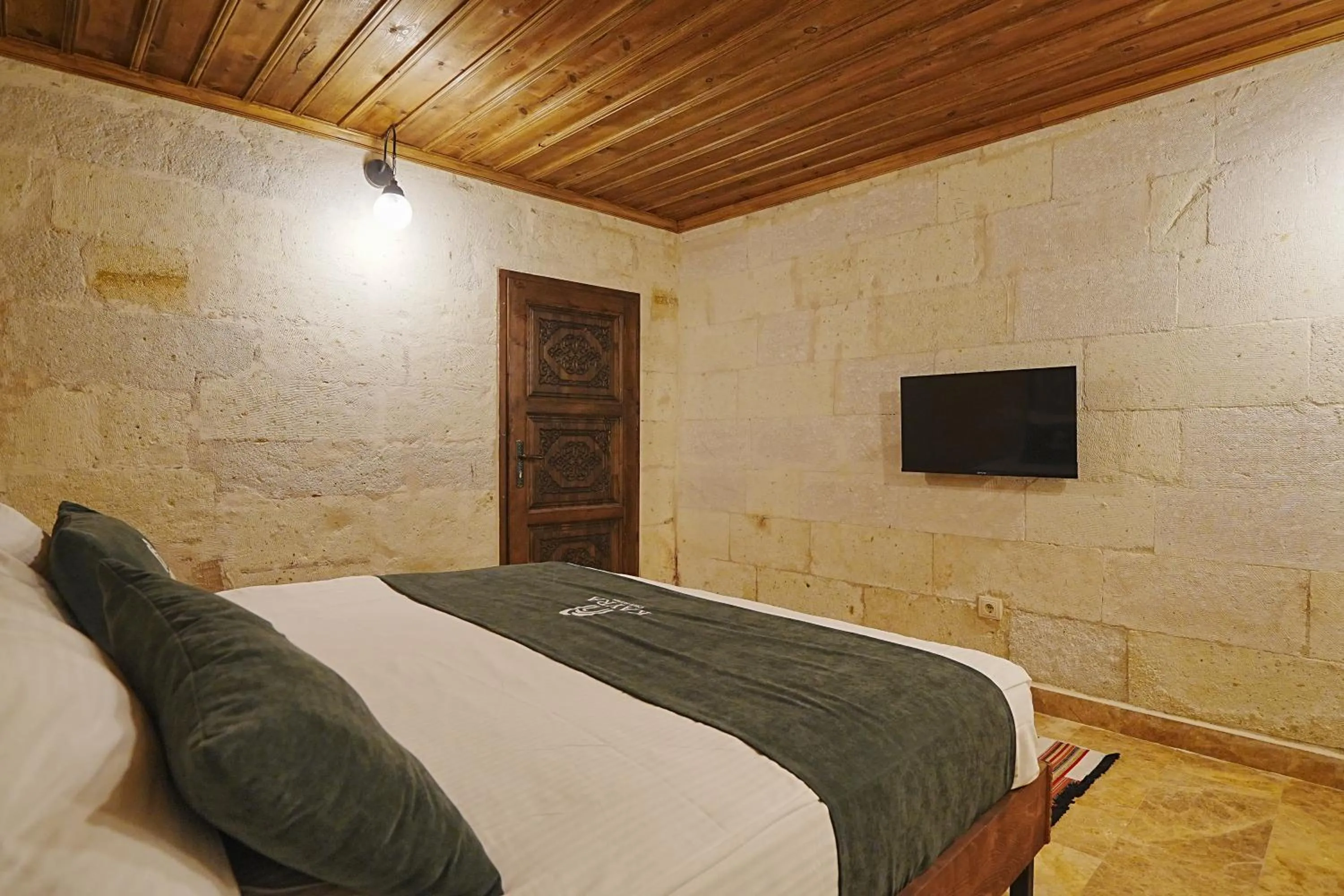 Bed in Kayra Cave Suites