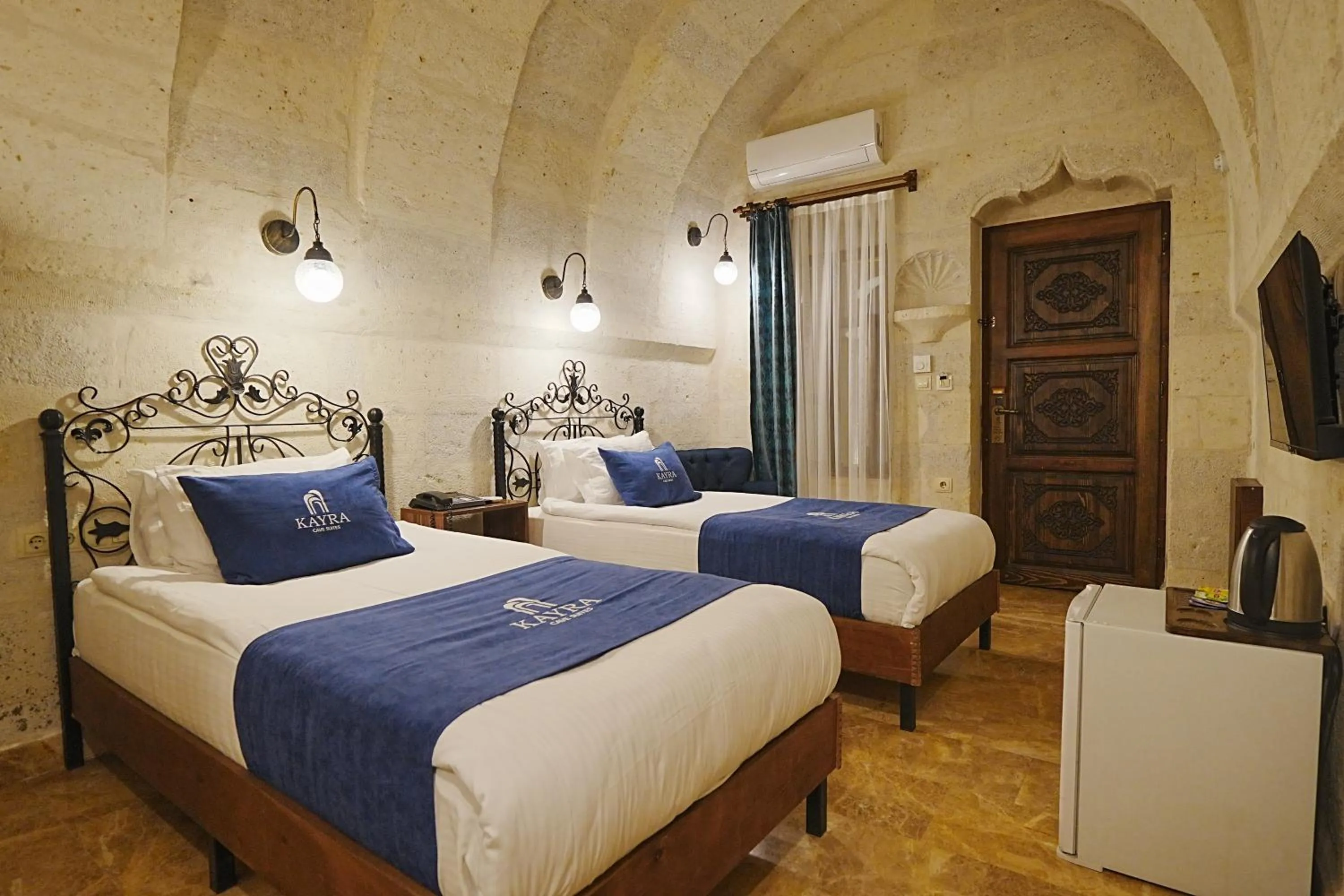Bed in Kayra Cave Suites