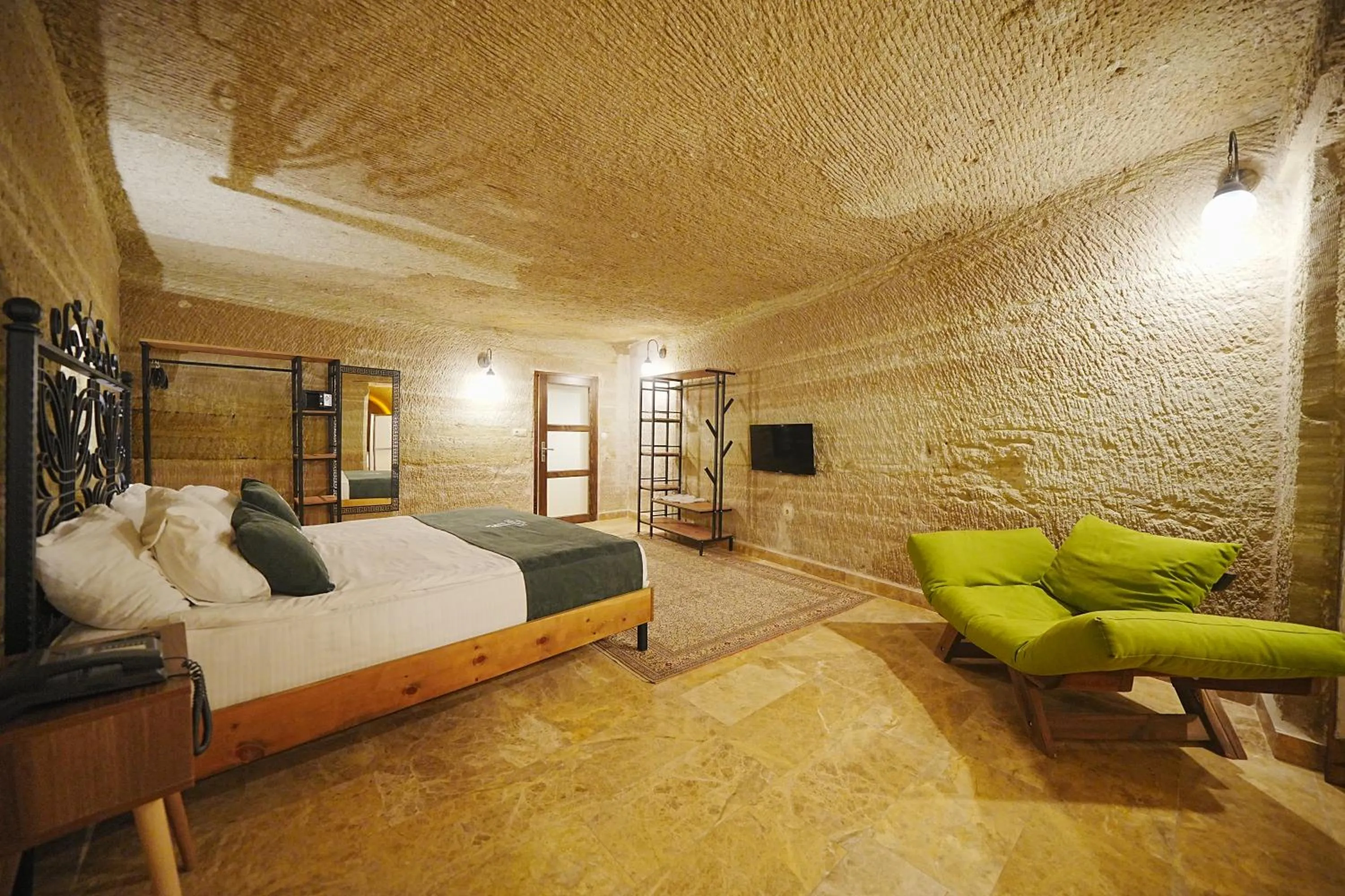 Bed in Kayra Cave Suites