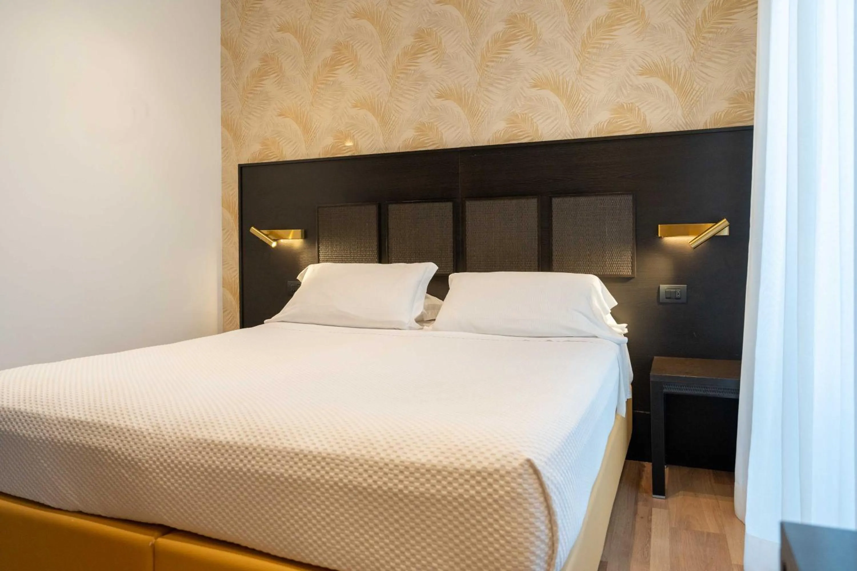 Bed in Hotel Florida Lerici