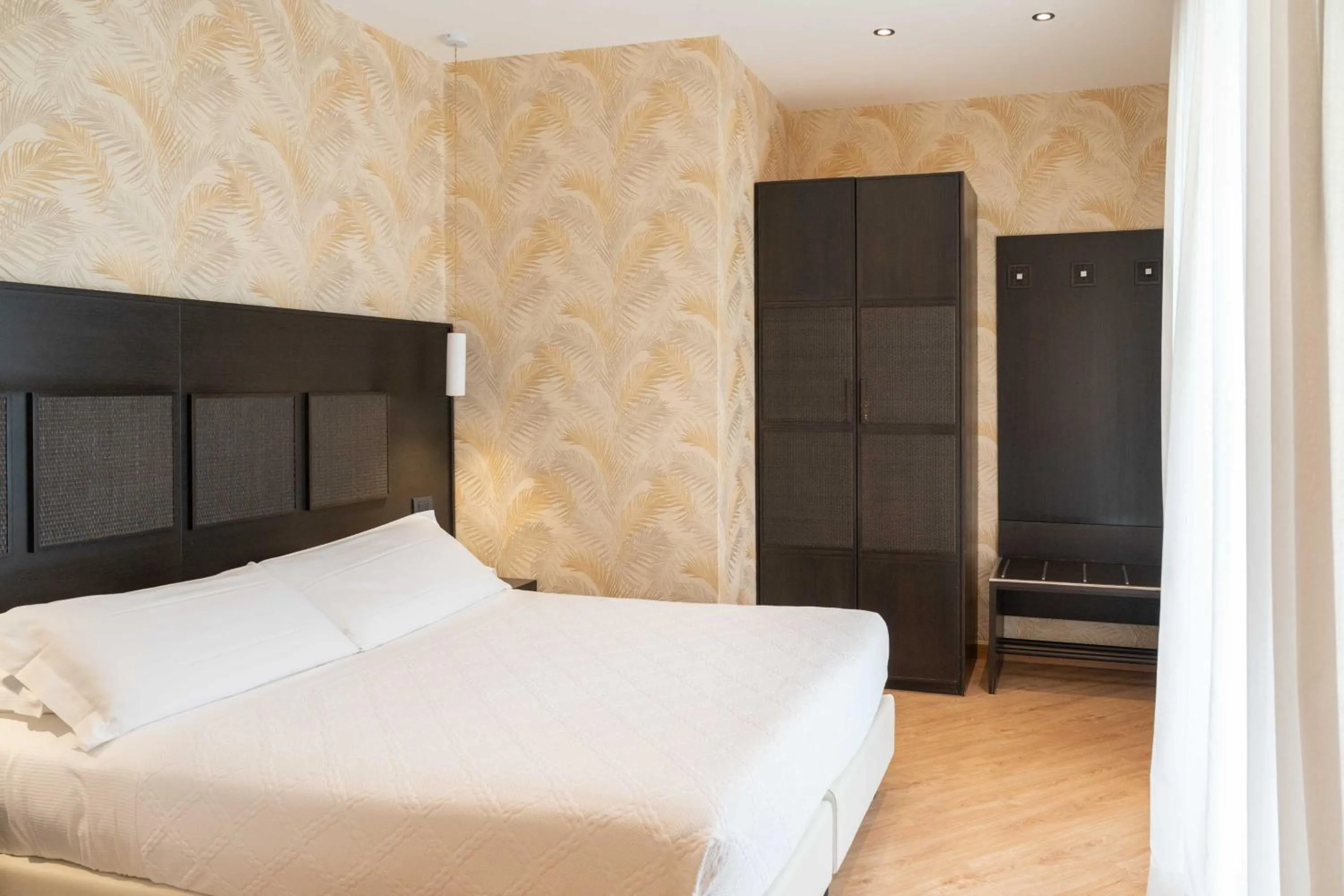 Bed in Hotel Florida Lerici