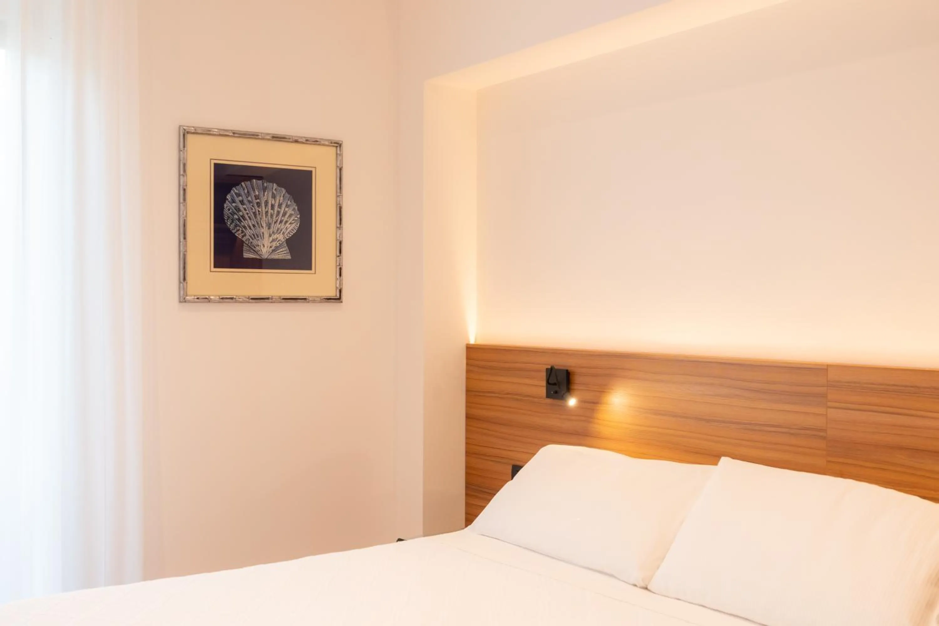 Bed in Hotel Florida Lerici