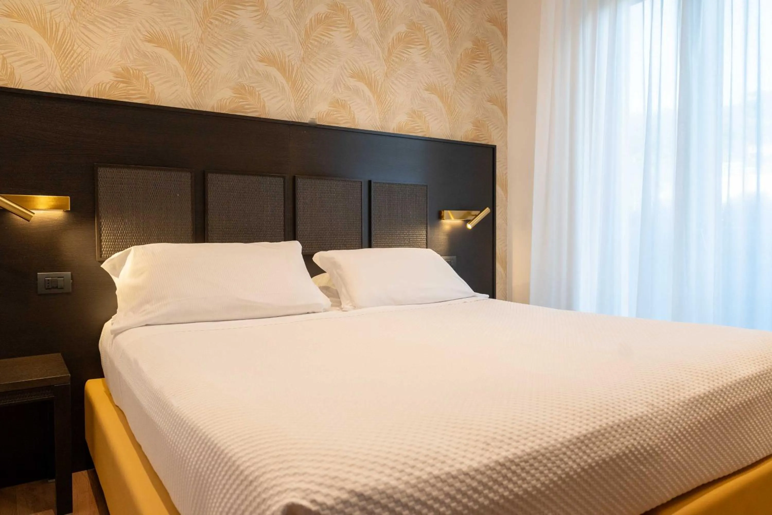 Bed in Hotel Florida Lerici