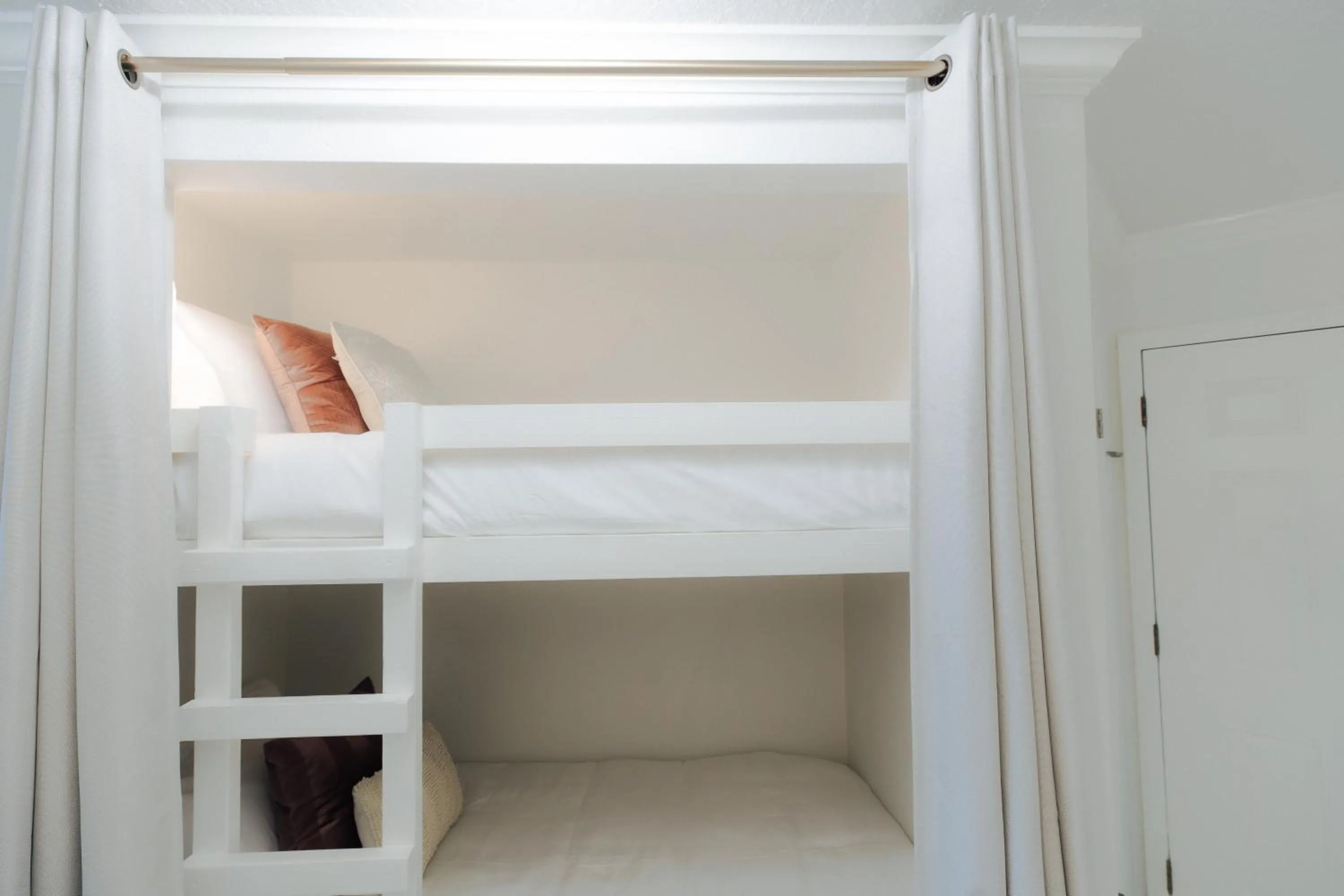 Bed in Crimson Beach Escape Ocean View-HotTub -Pool-LongStay - 1 Queen Bedroom plus Alcove bunk Beds and a Sofa