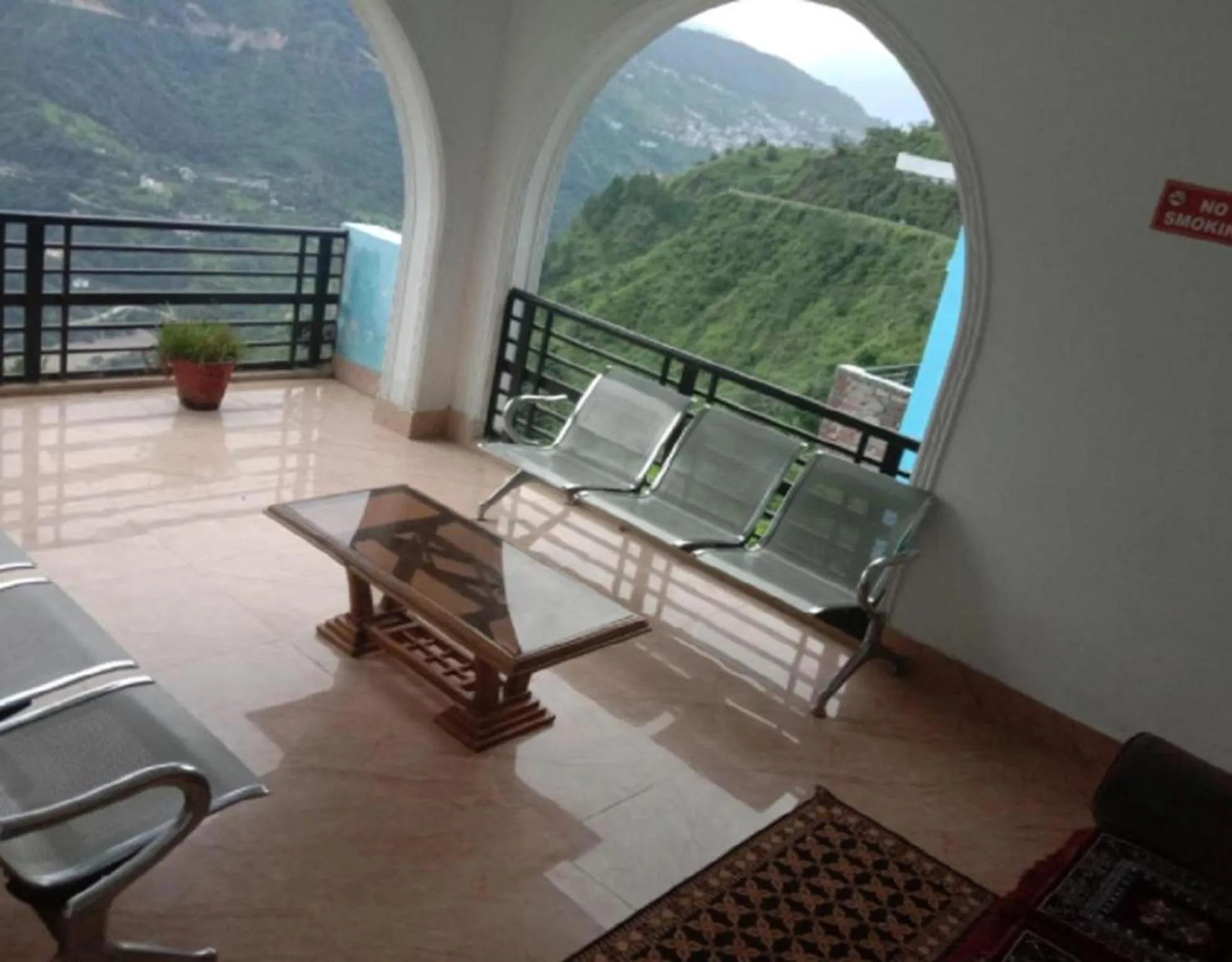 Seating area in HOTEL PUSPWAN AND RESTAURANT by StayApart