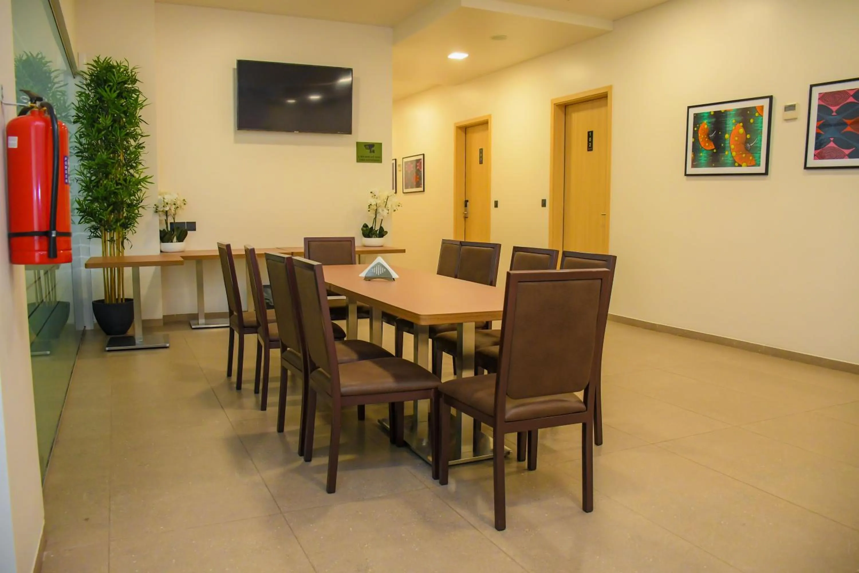 Dining area in AQUA INN Hotel