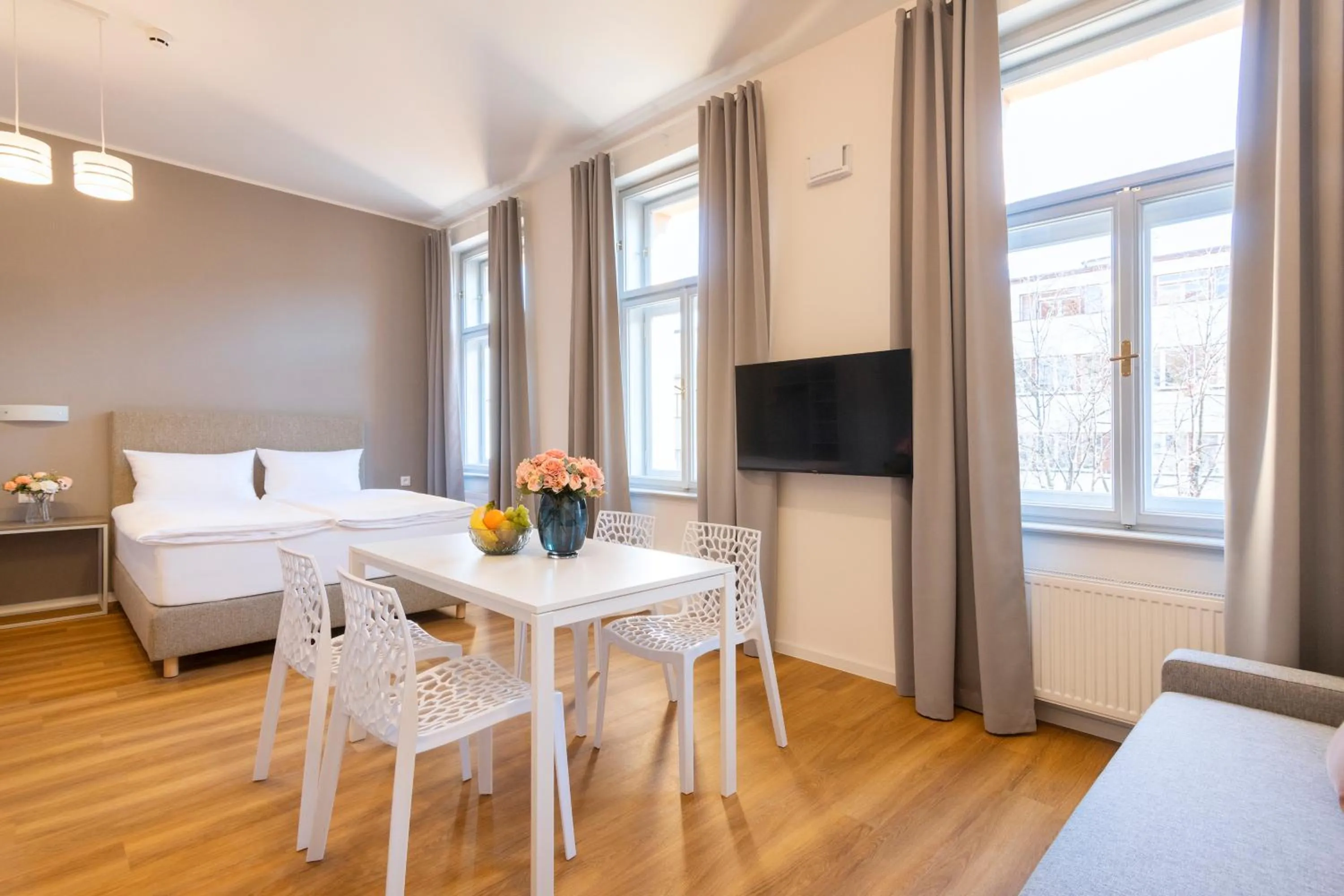 Dining area, Bed in Hidden Art Boutique Residence by Dwellfort