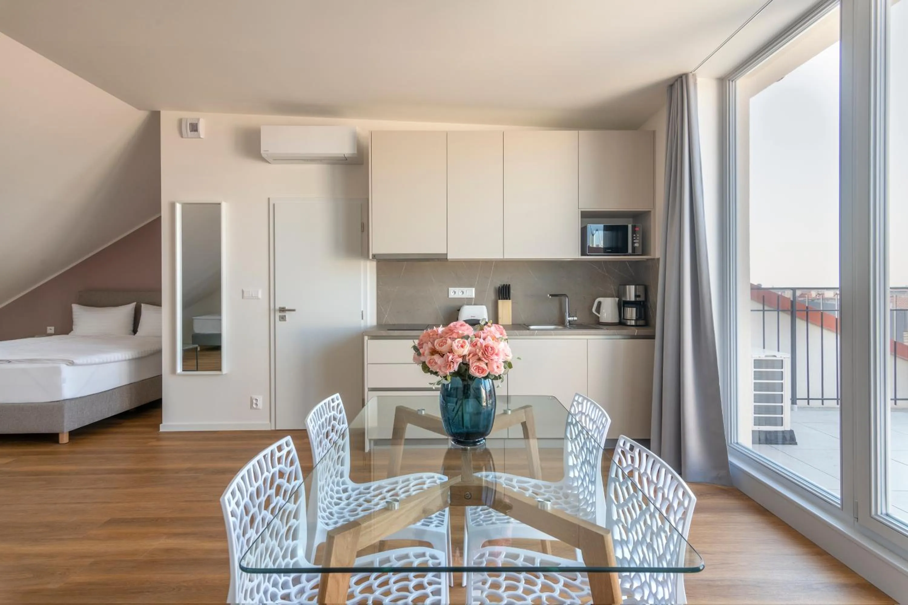 Dining area, Bed in Hidden Art Boutique Residence by Dwellfort