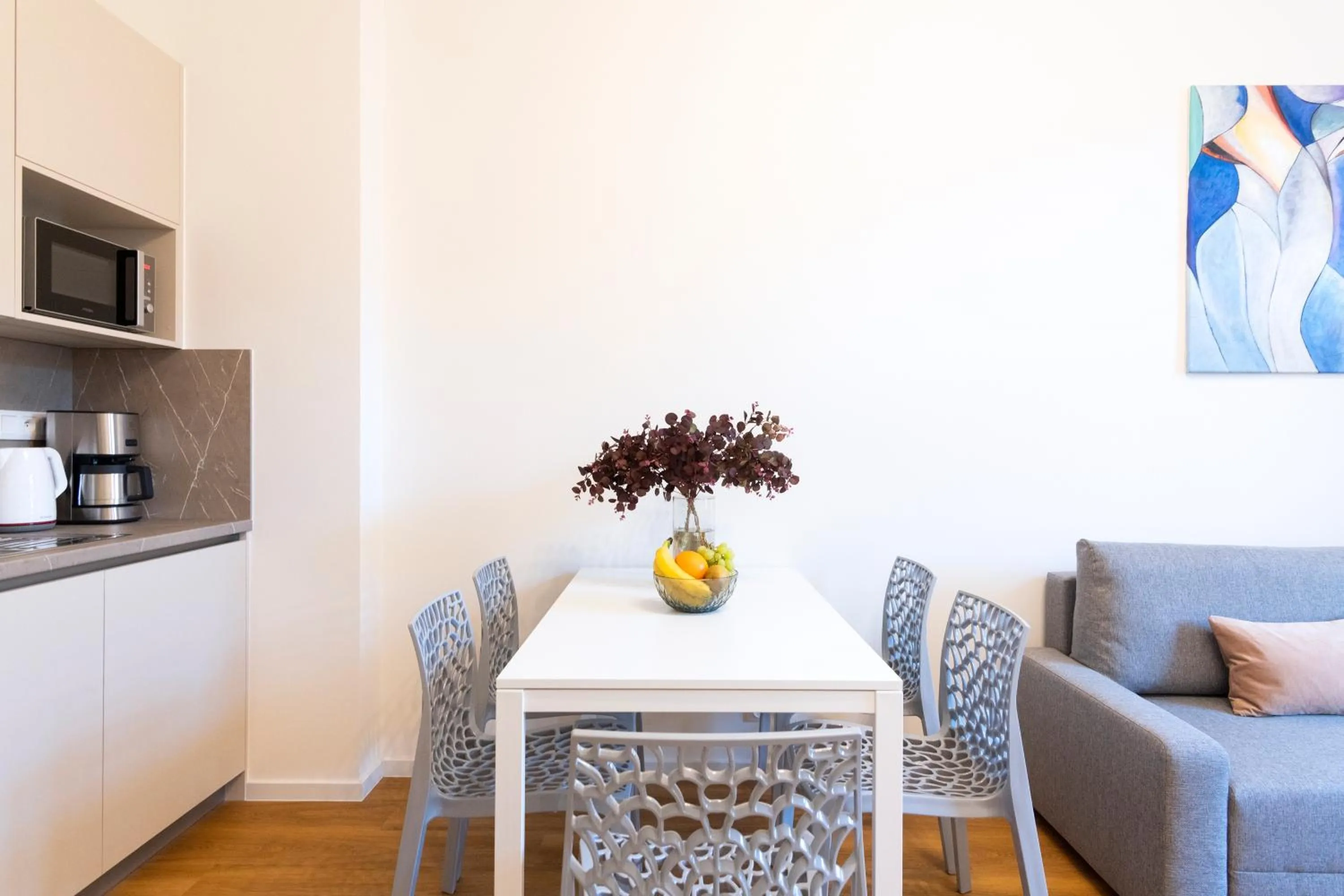 Dining area in Hidden Art Boutique Residence by Dwellfort