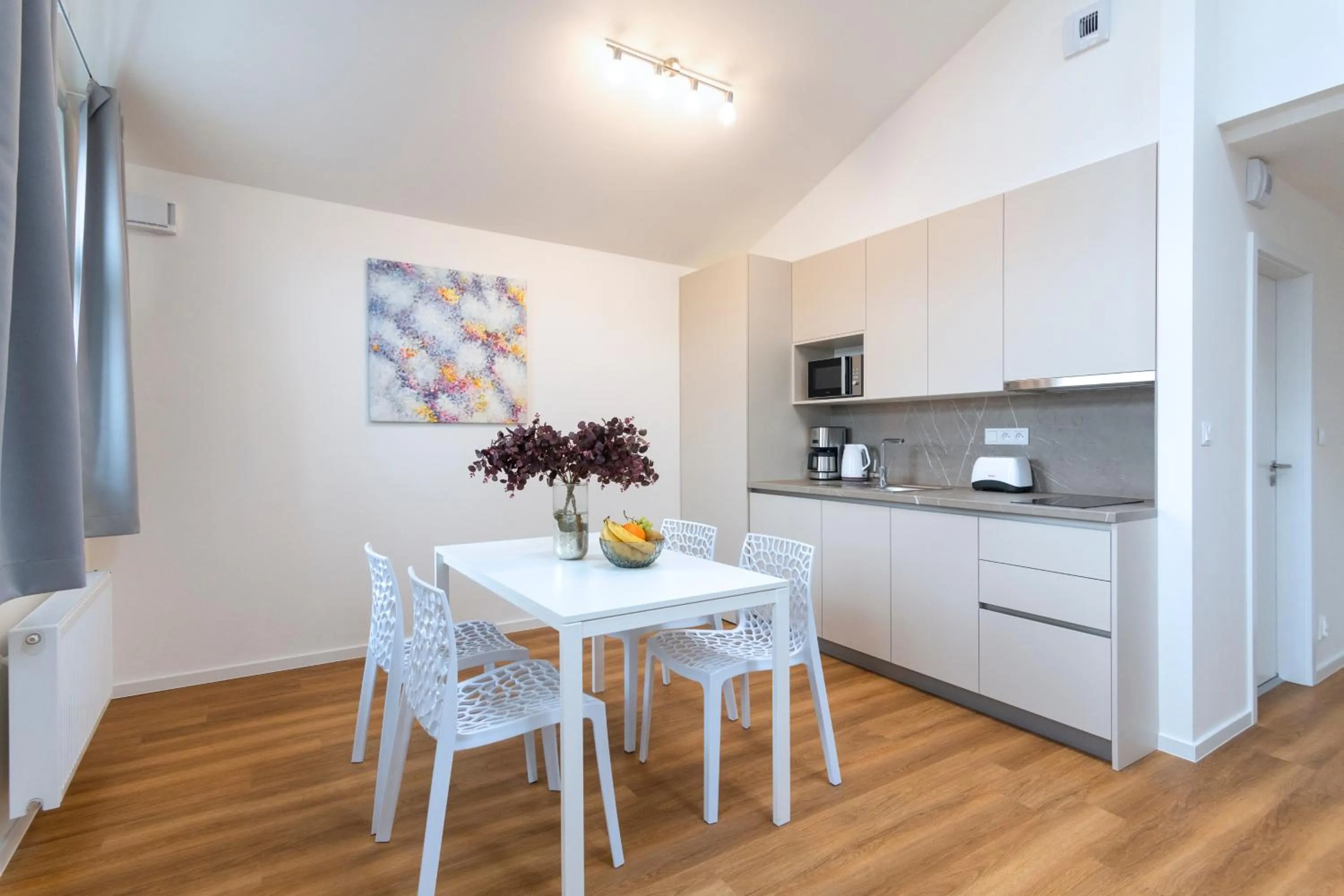 Dining area in Hidden Art Boutique Residence by Dwellfort