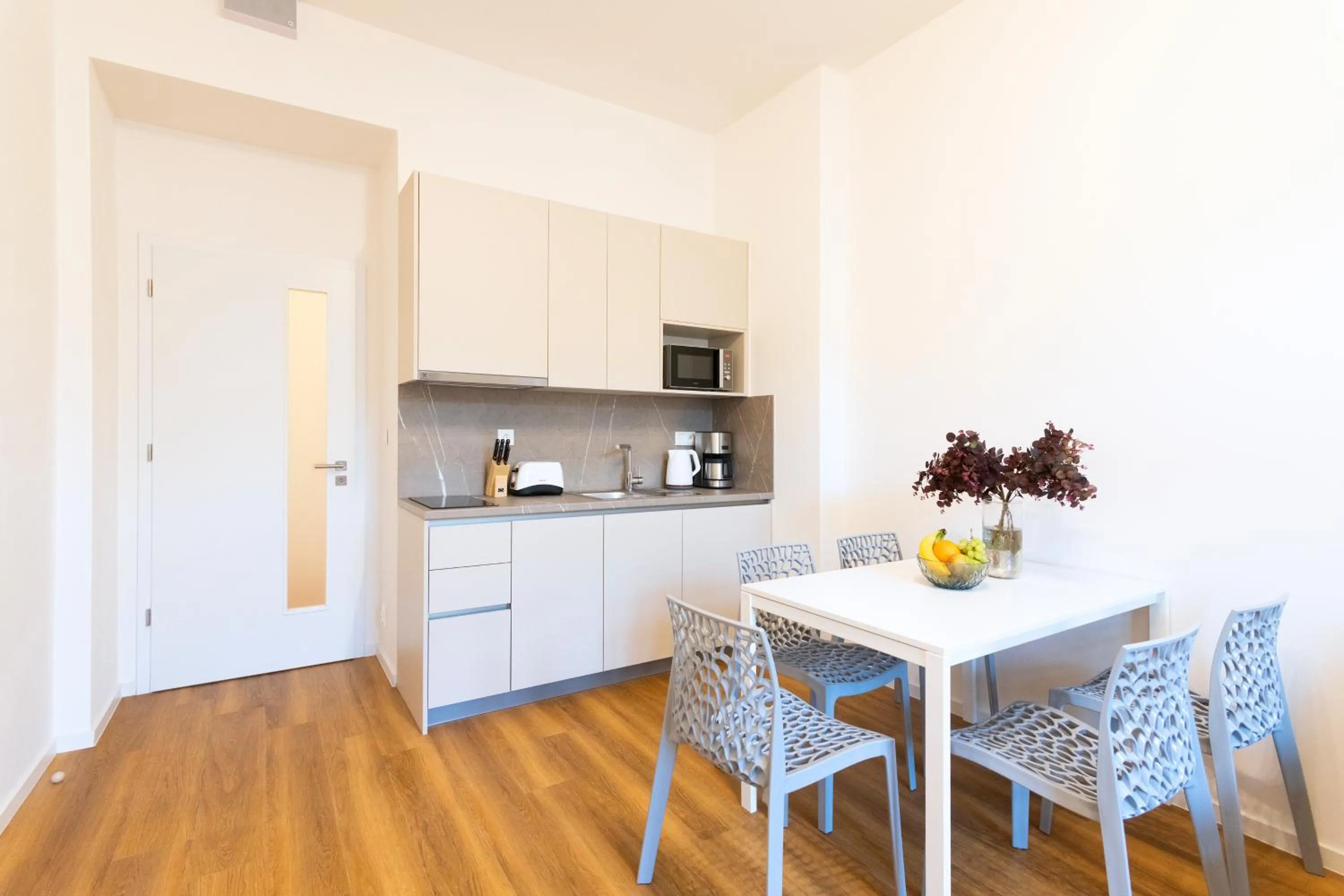 Kitchen or kitchenette in Hidden Art Boutique Residence by Dwellfort