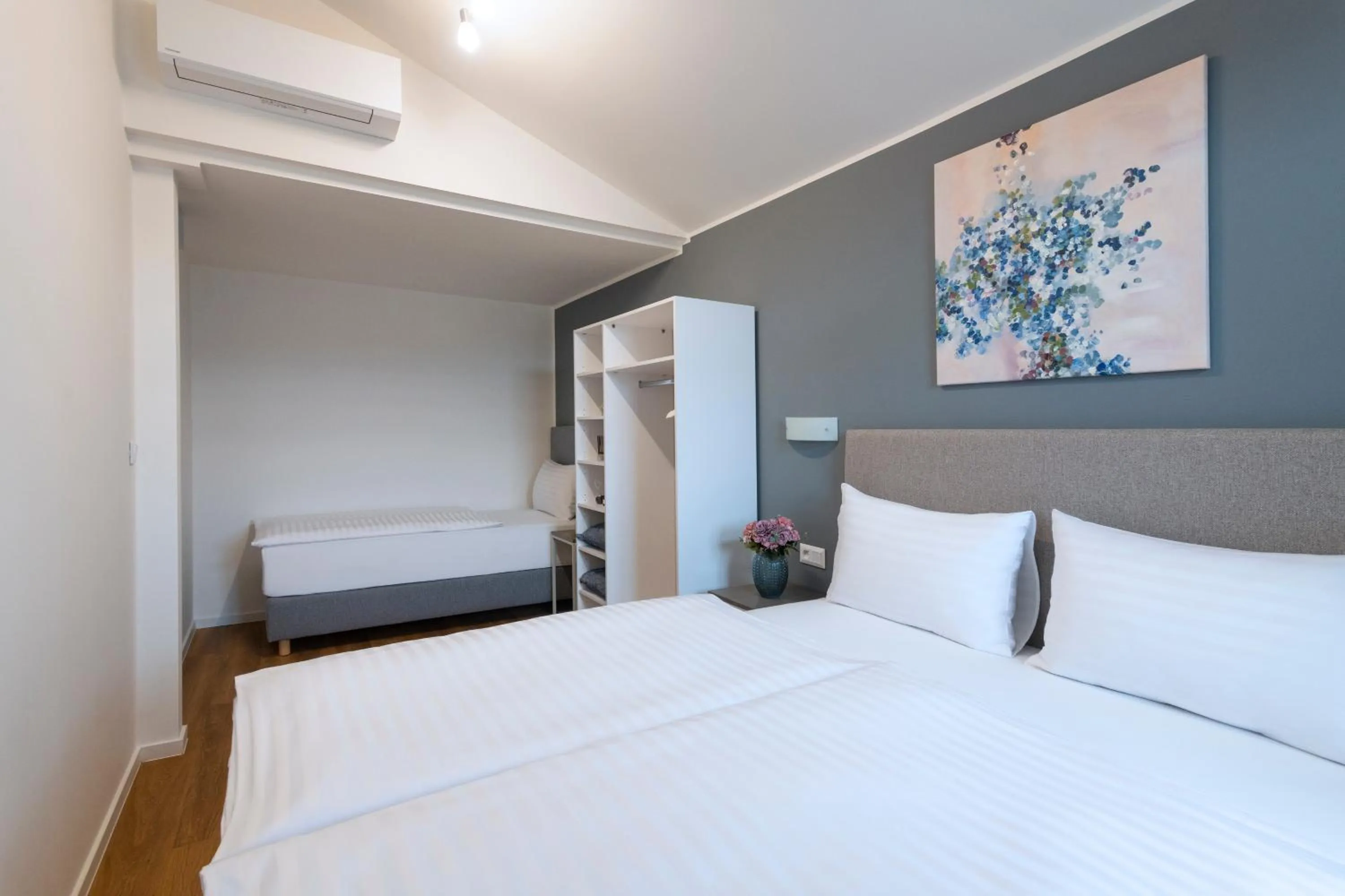 Bed in Hidden Art Boutique Residence by Dwellfort