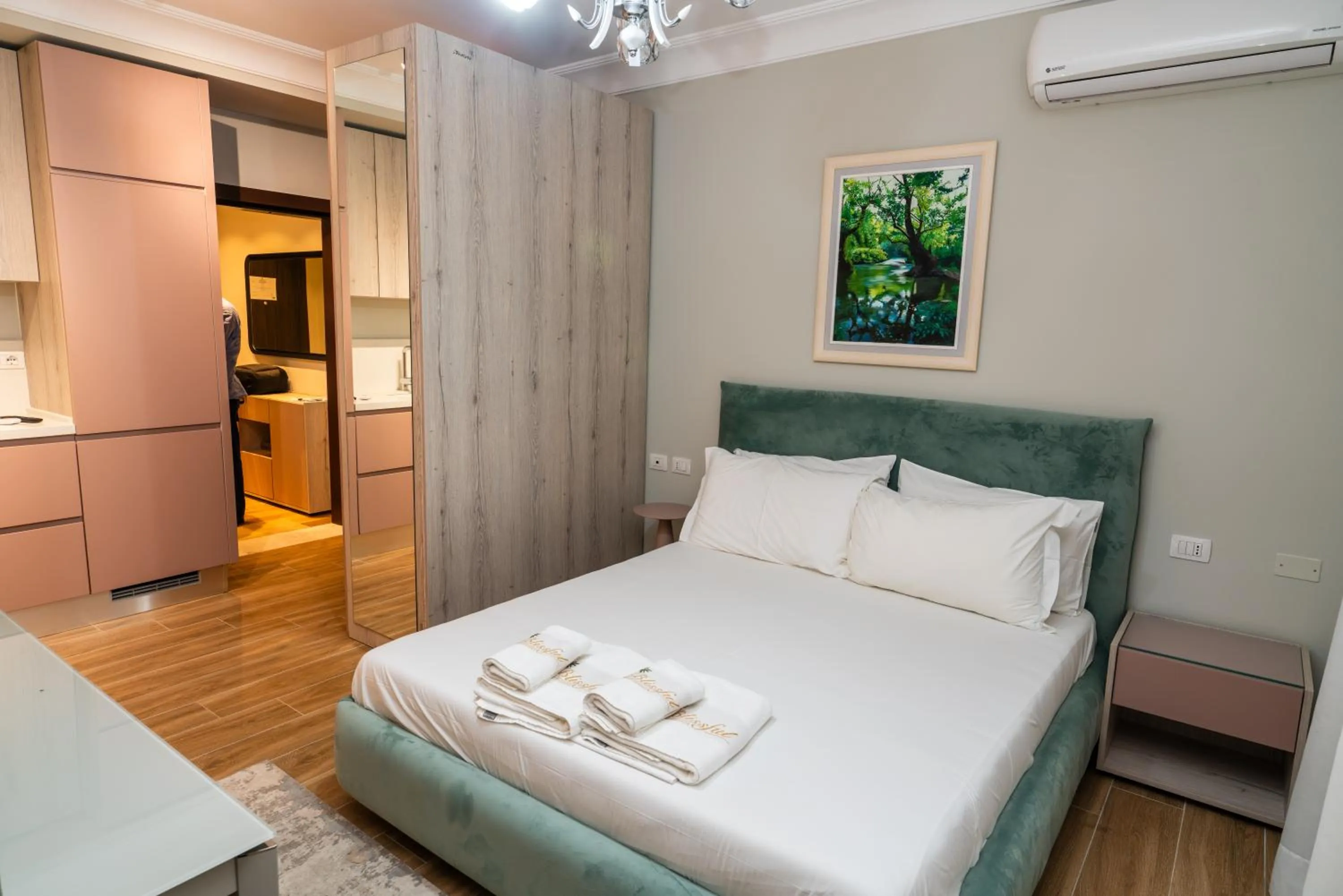 Bed in Blissful Apartments