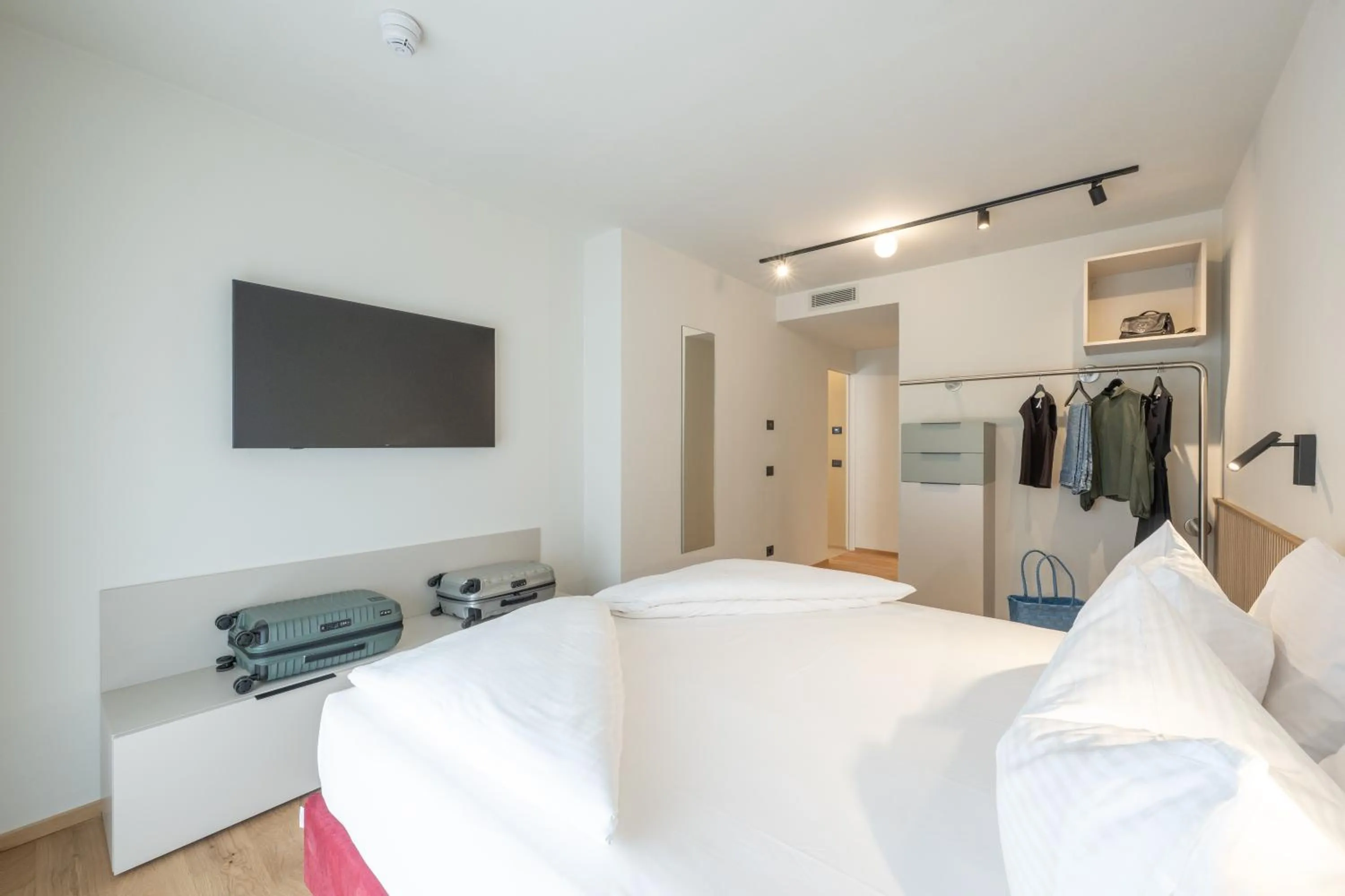 Bed in Etra Suites & Apartments