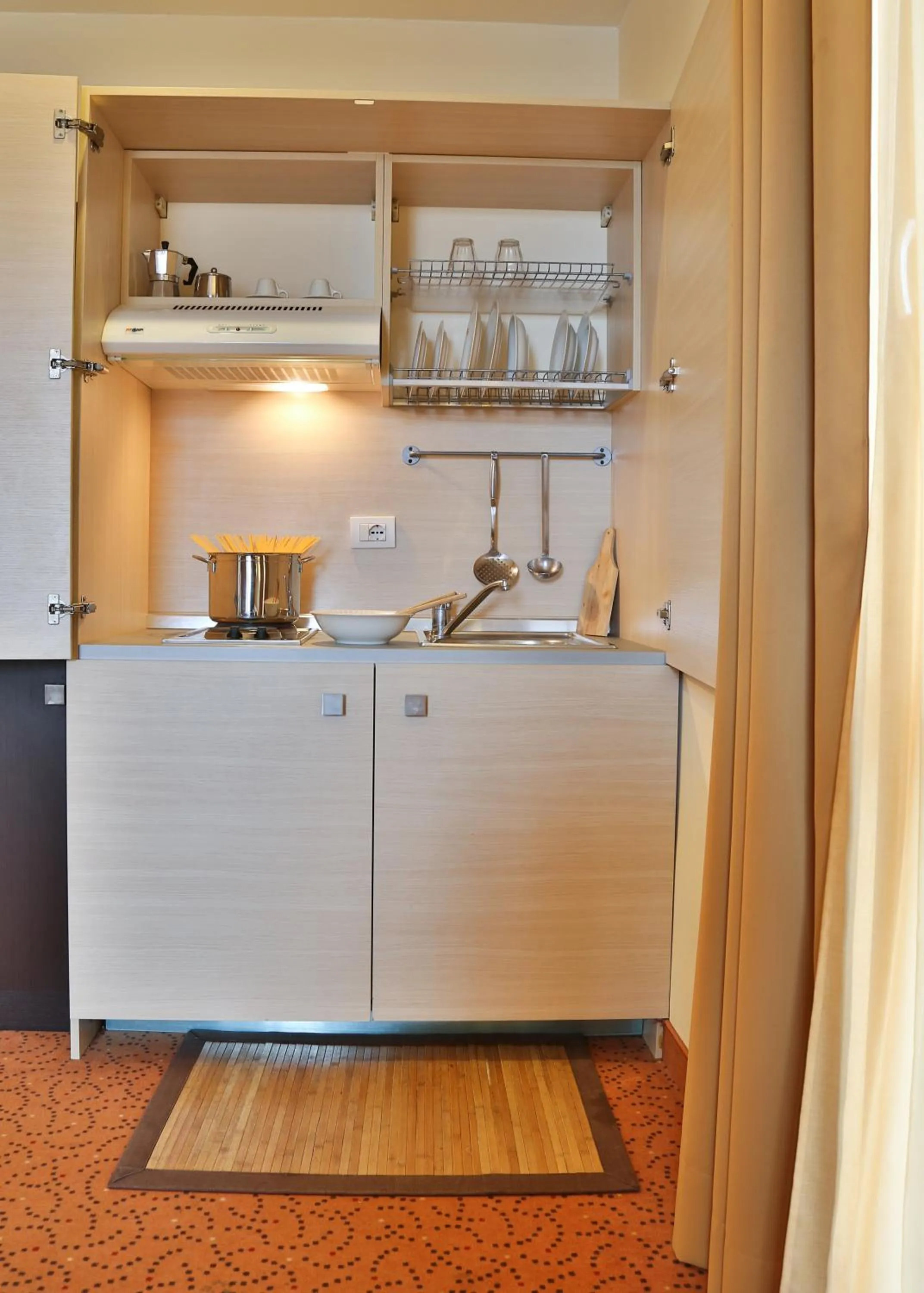 Kitchen or kitchenette in Regal Hotel
