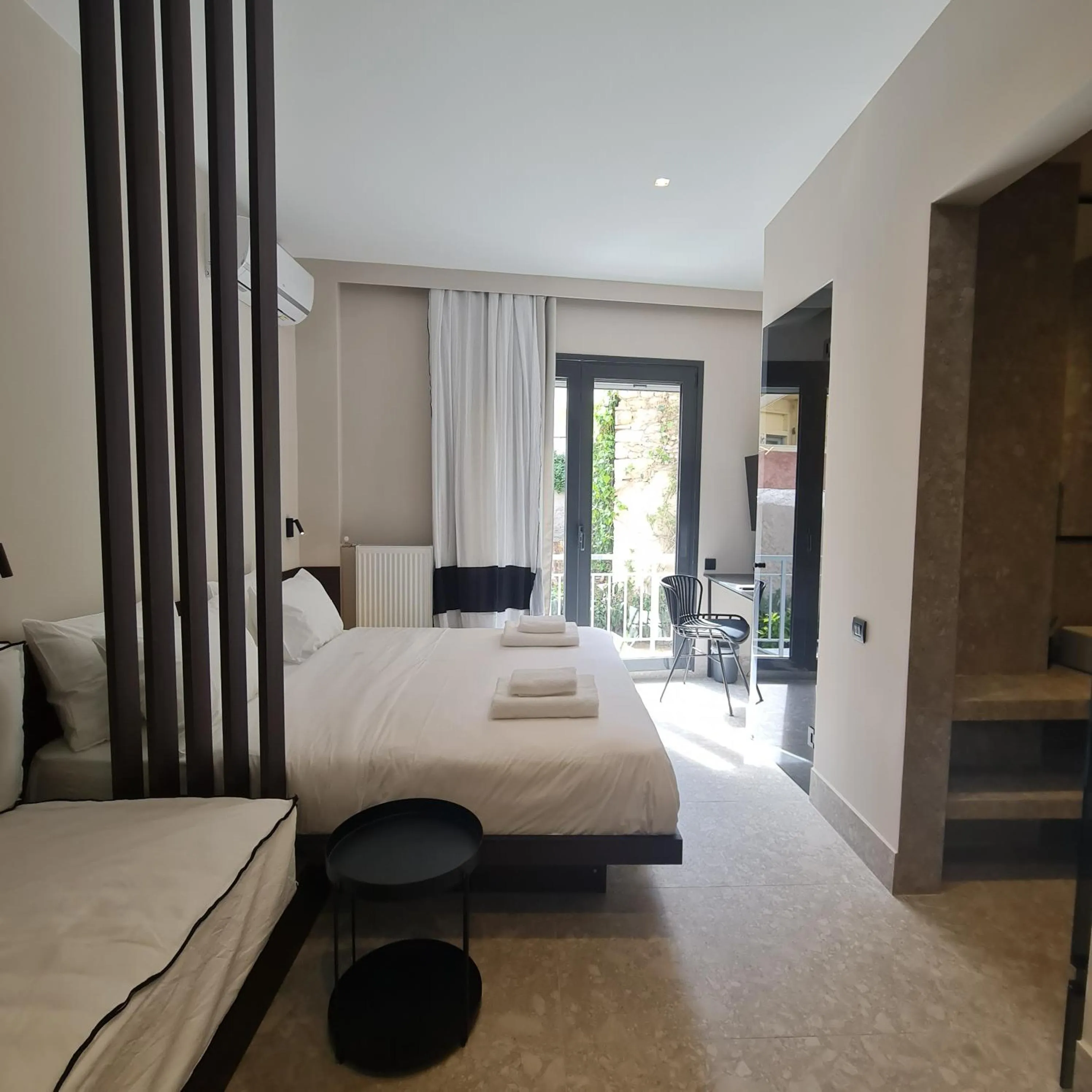 Photo of the whole room, Bed in Cityzoe Athens Suites