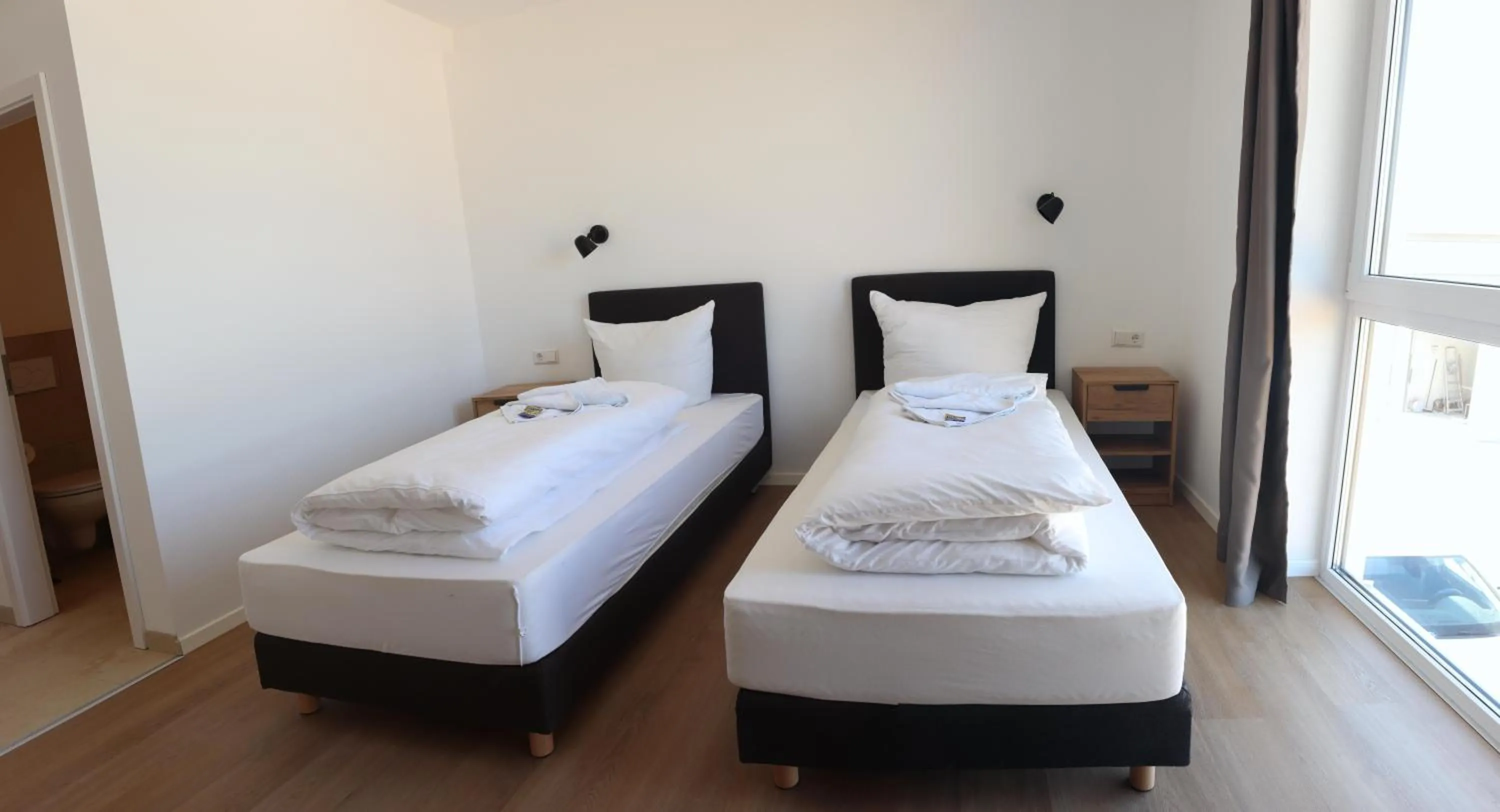 Bed in Motel Bergtheim - Self Check-in