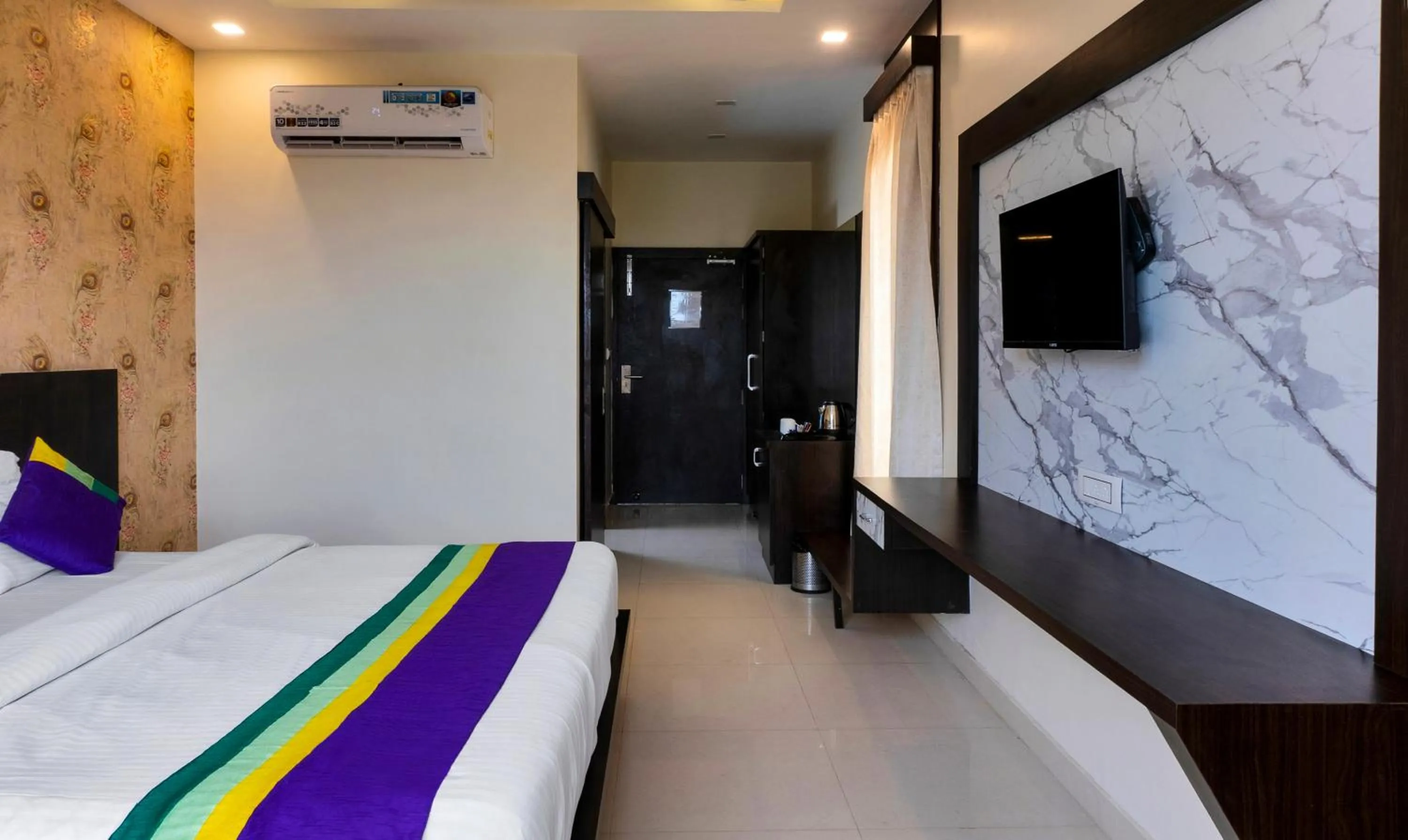 Bedroom, Bed in Treebo Premium Royal Amar With Mountain View and Swimming Pool