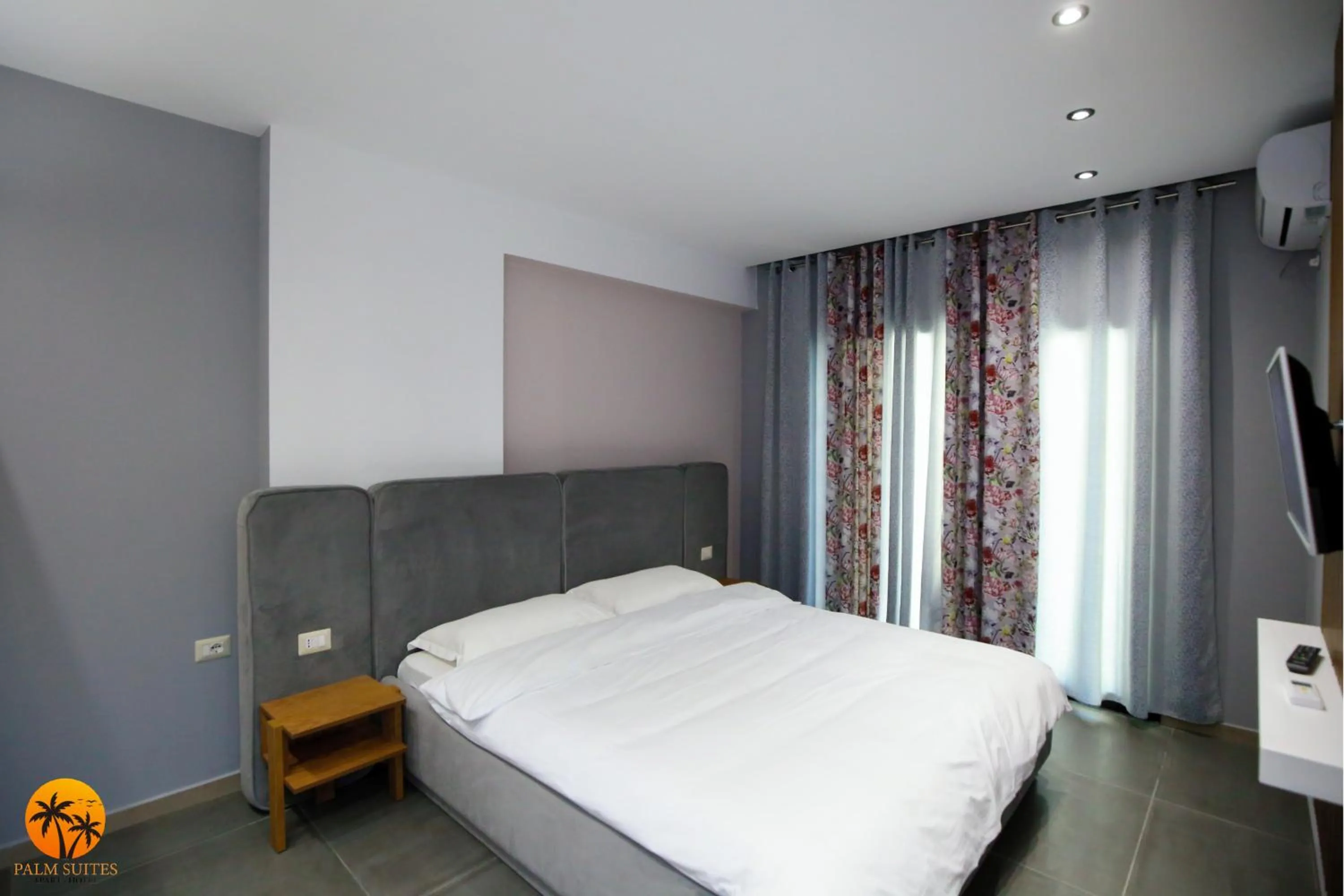 Bed in Palm Suites Apartment-Suite