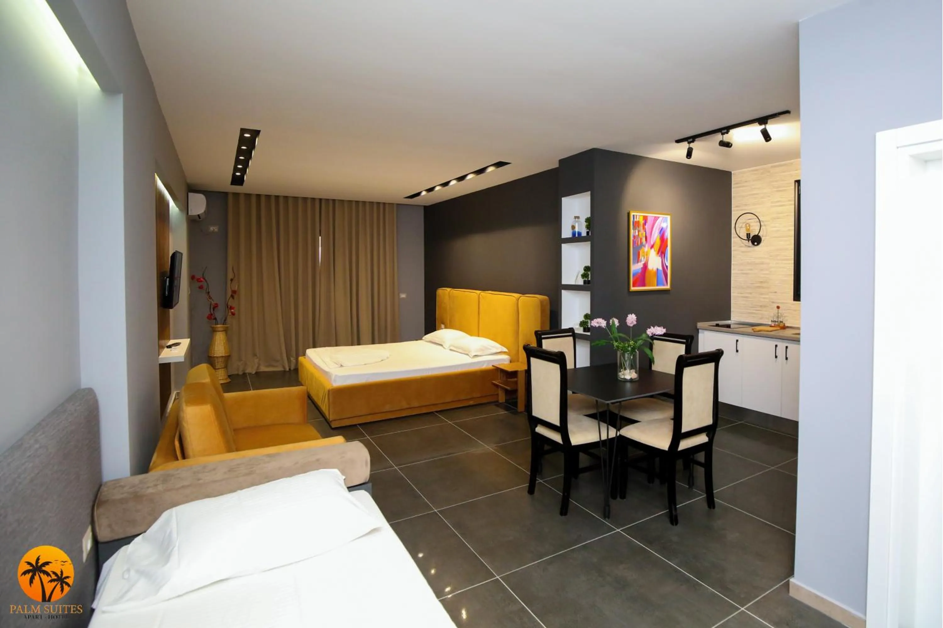 Bed in Palm Suites Apartment-Suite