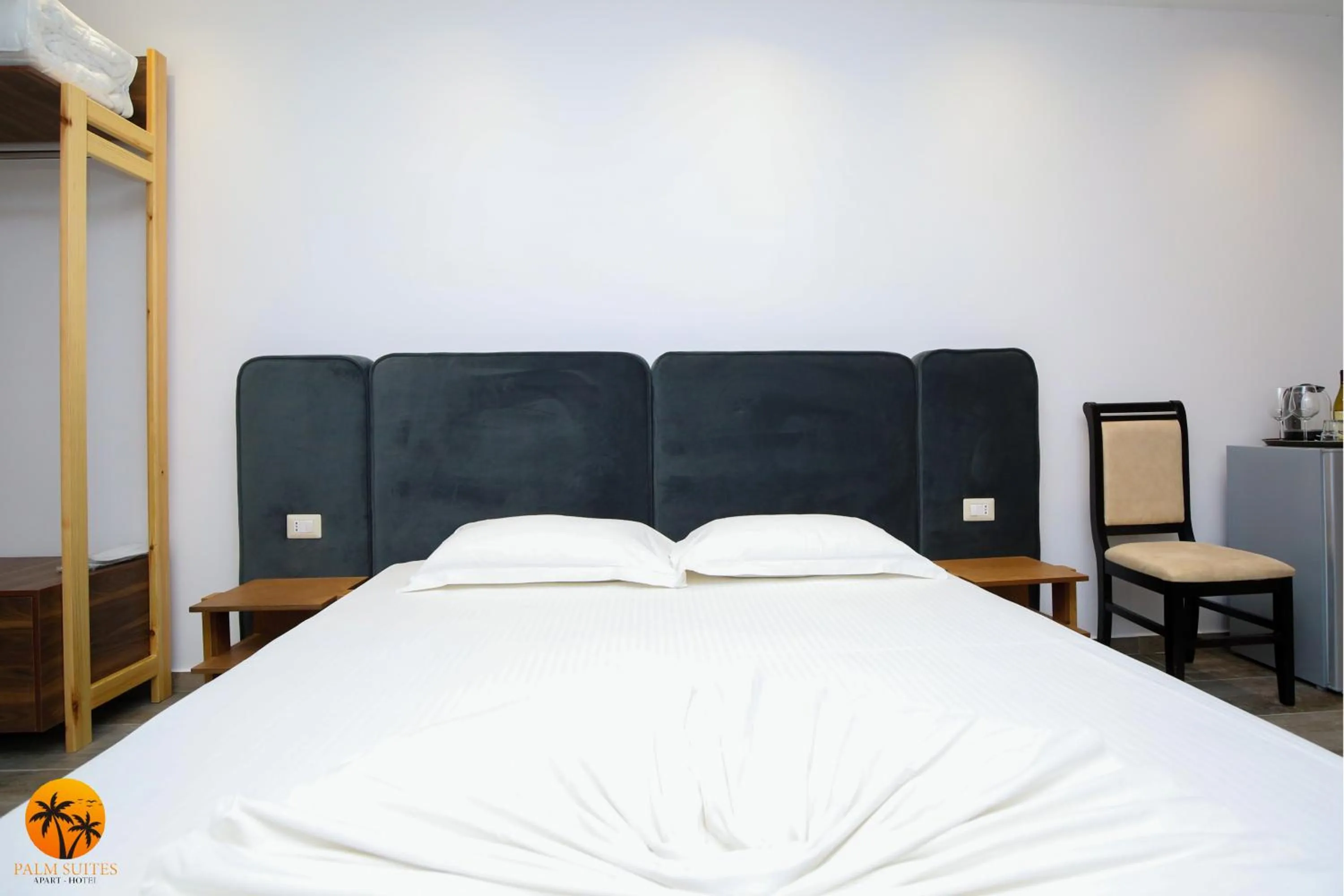 Bed in Palm Suites Apartment-Suite