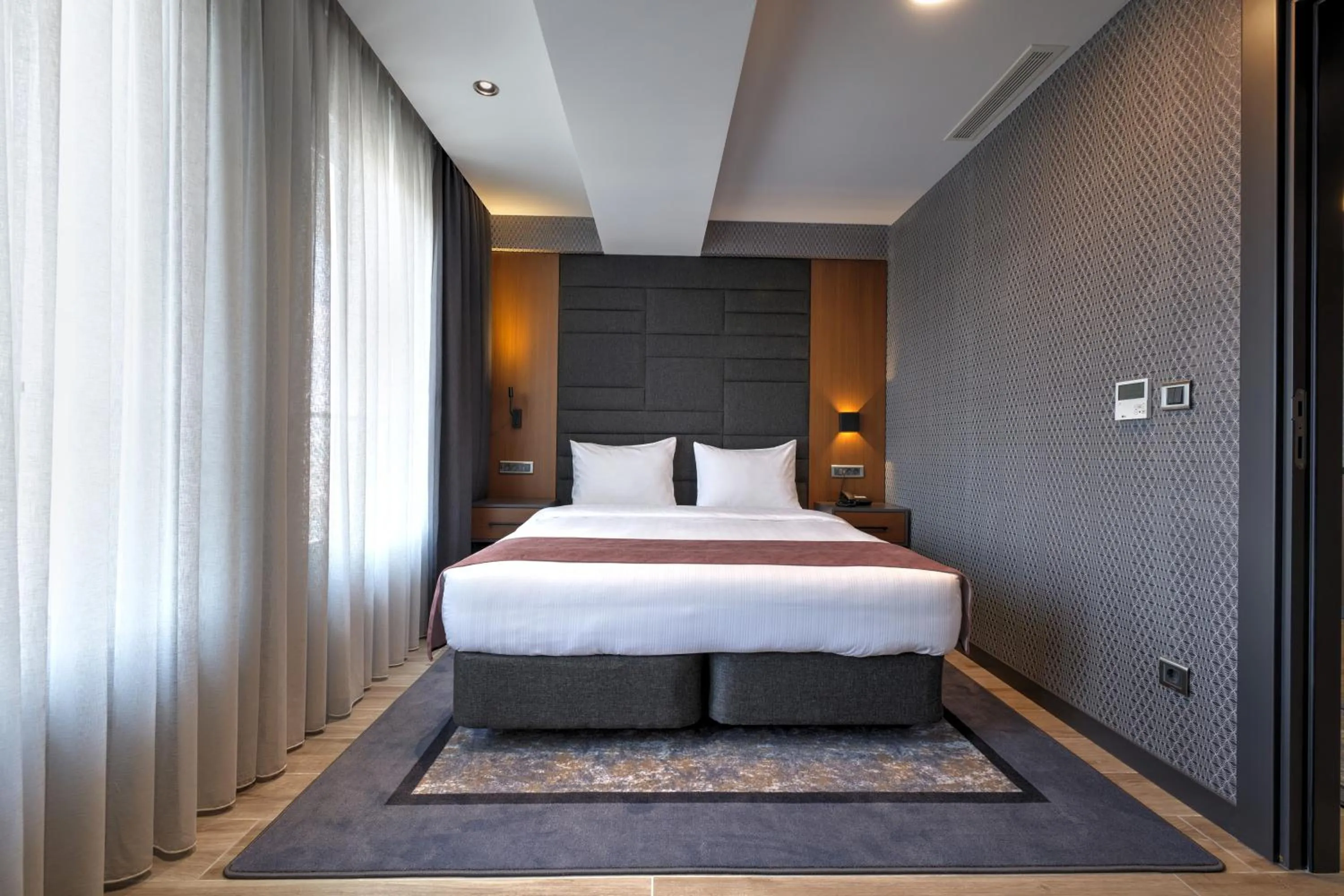 Bed in Nova Vista Deluxe & Suites a Member of Radisson Individuals