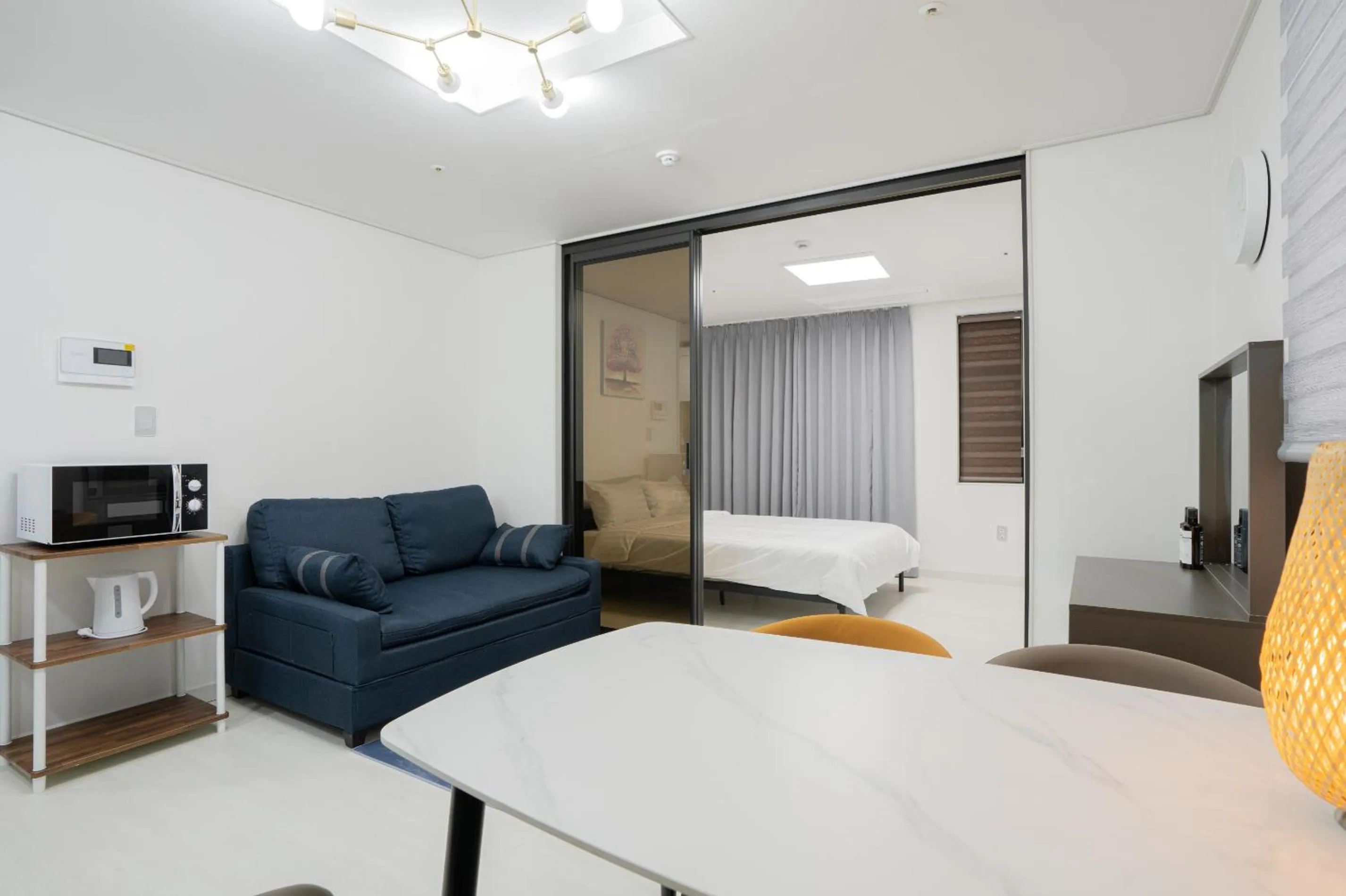 Bed in Jeju Seomun Residence Hotel