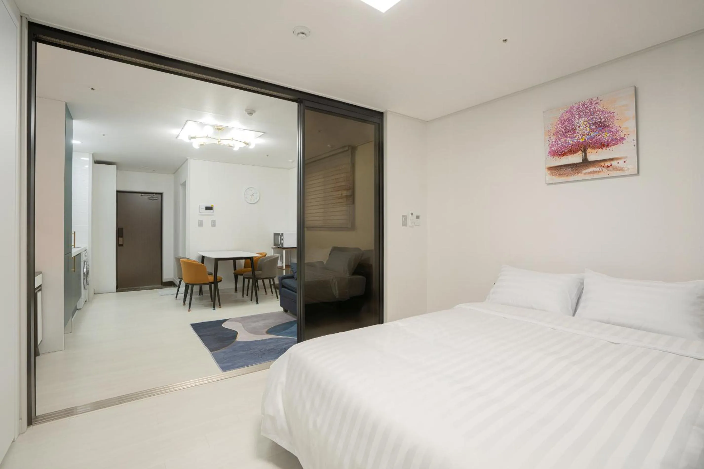 Bed in Jeju Seomun Residence Hotel