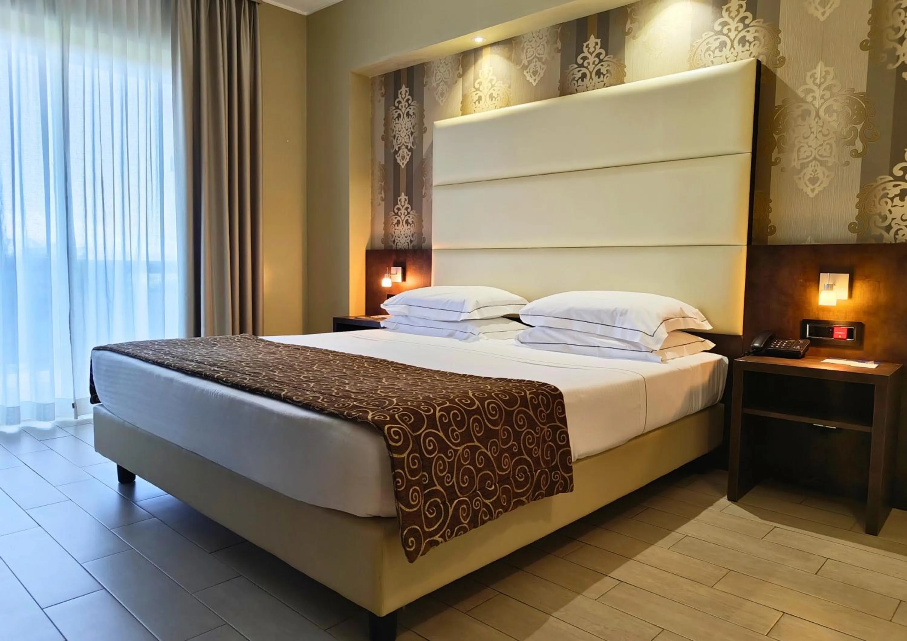 Bed in Hotel Pineta Palace