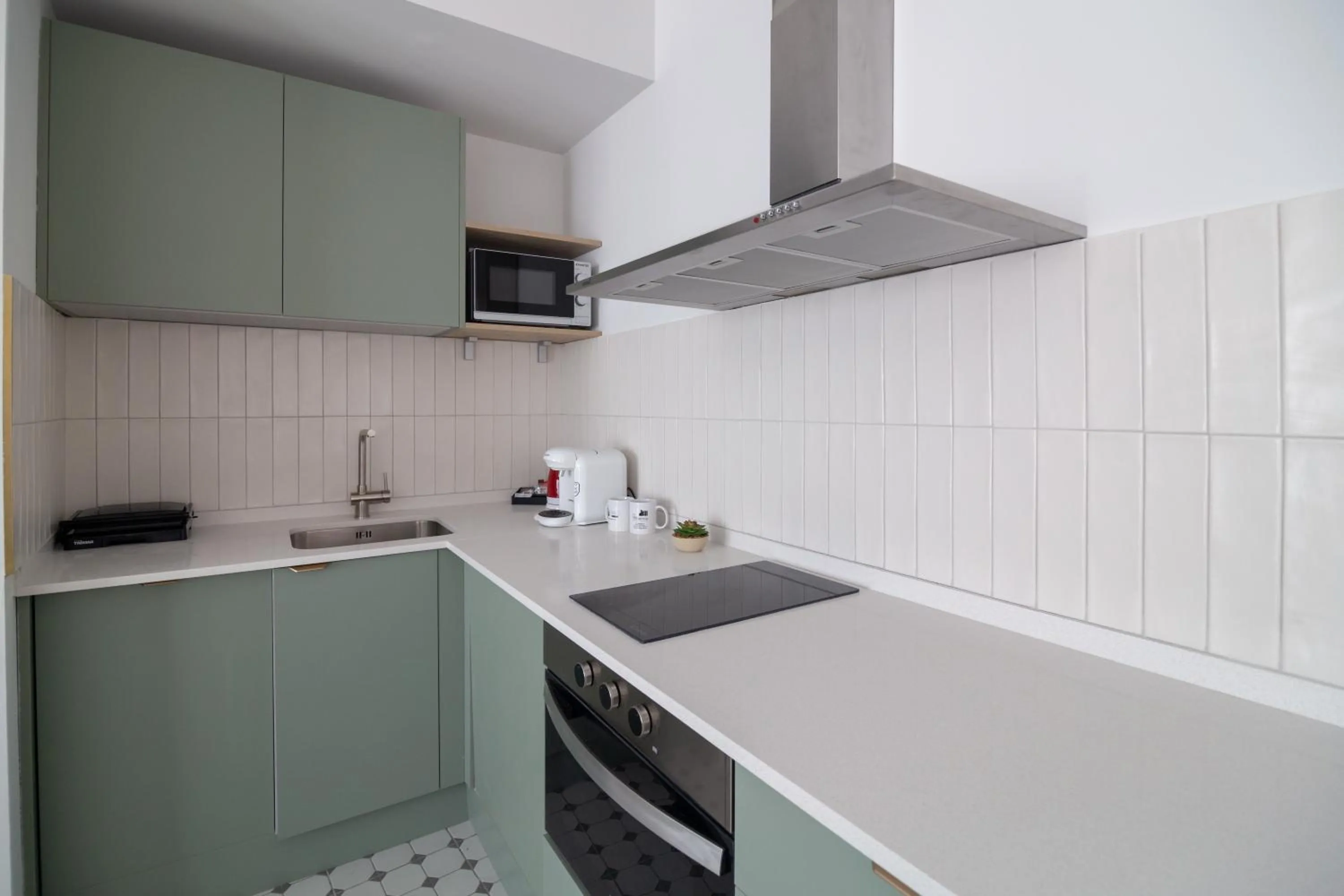Kitchen or kitchenette in Apartamentos Teatro by Be Alicante