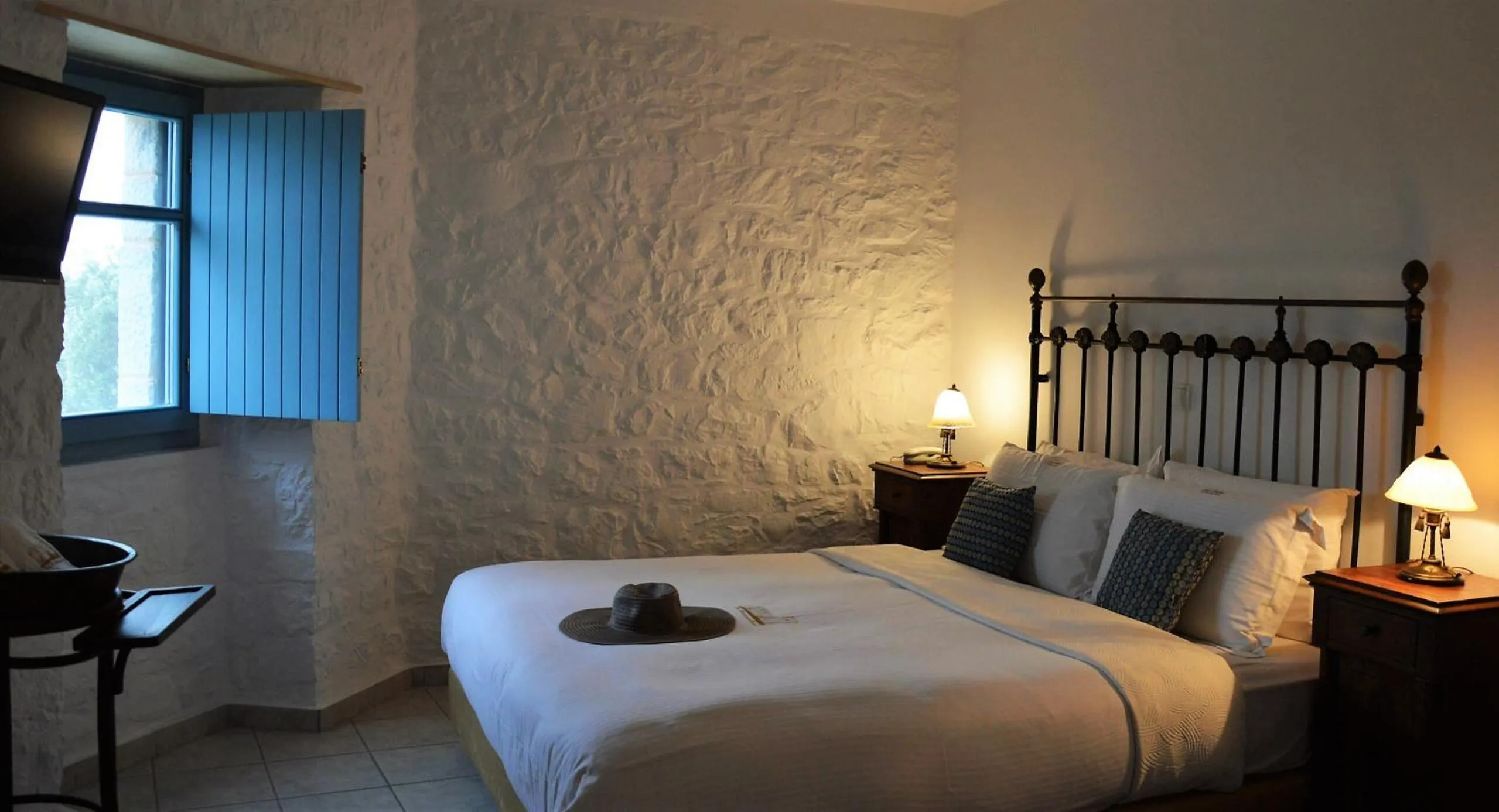 Photo of the whole room, Bed in Lithos Stone Suites