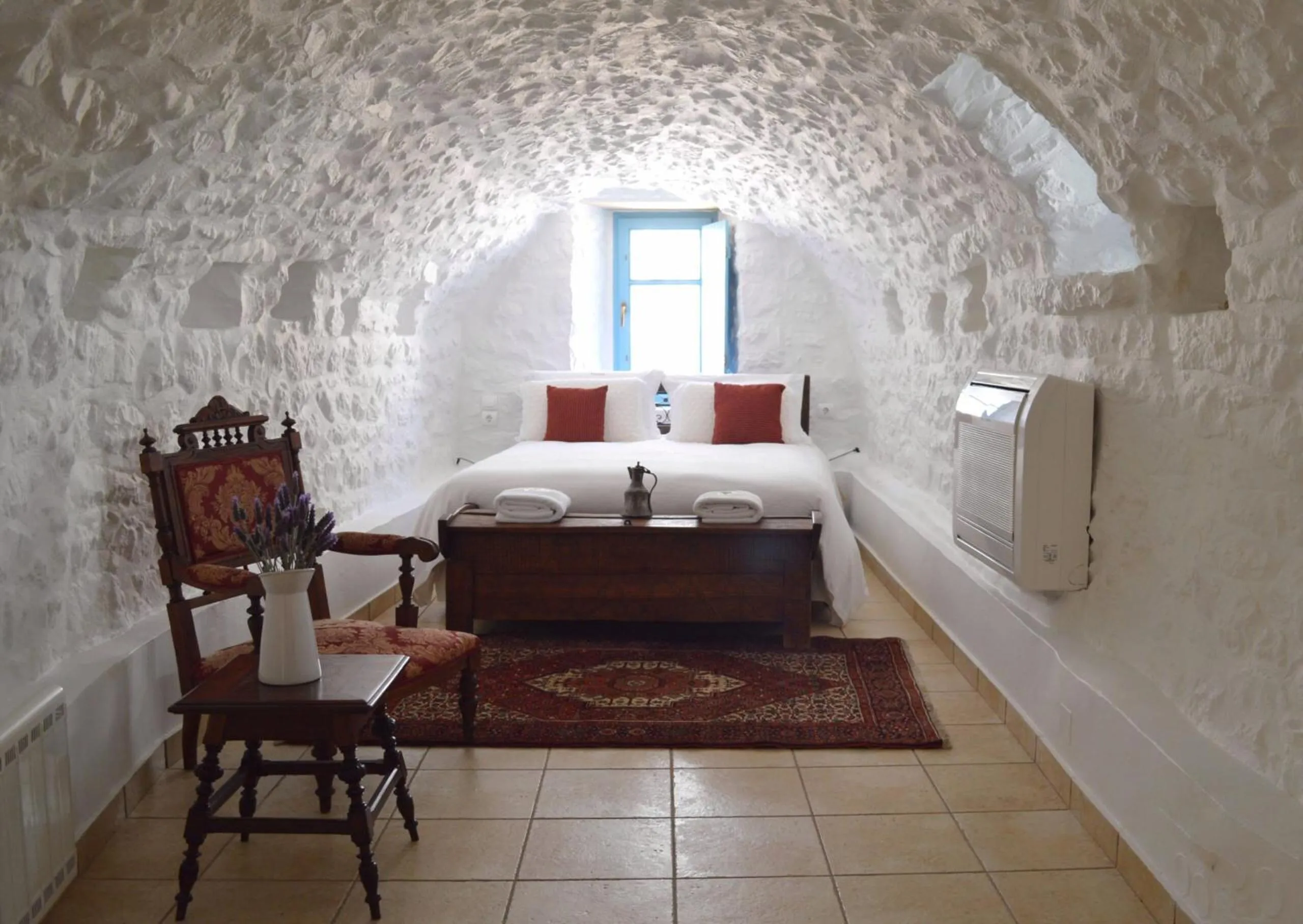 Photo of the whole room, Bed in Lithos Stone Suites