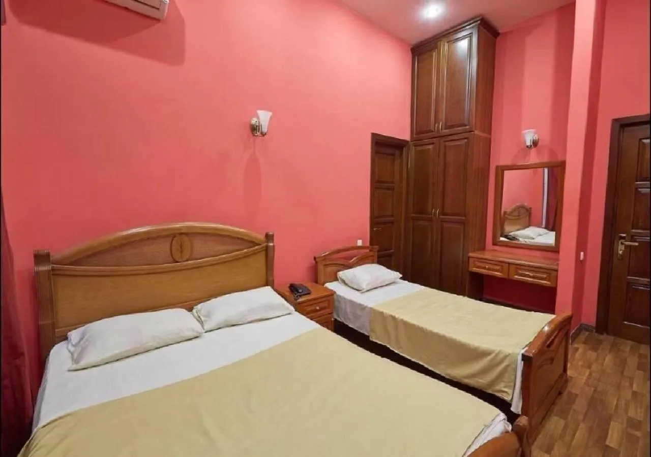 Bed in NEW BELLA HOTEL