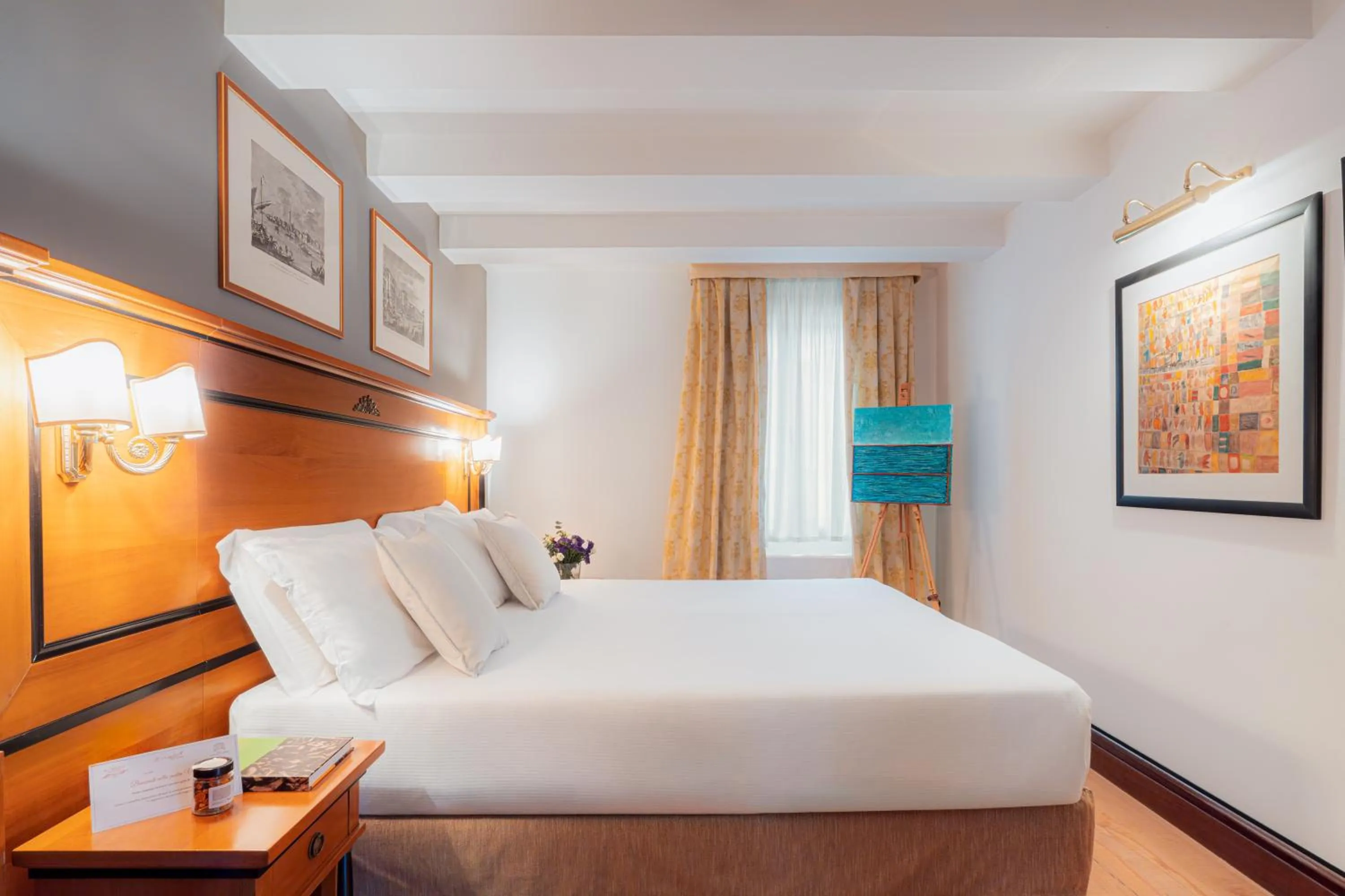 Bed in All’Angelo Art Hotel