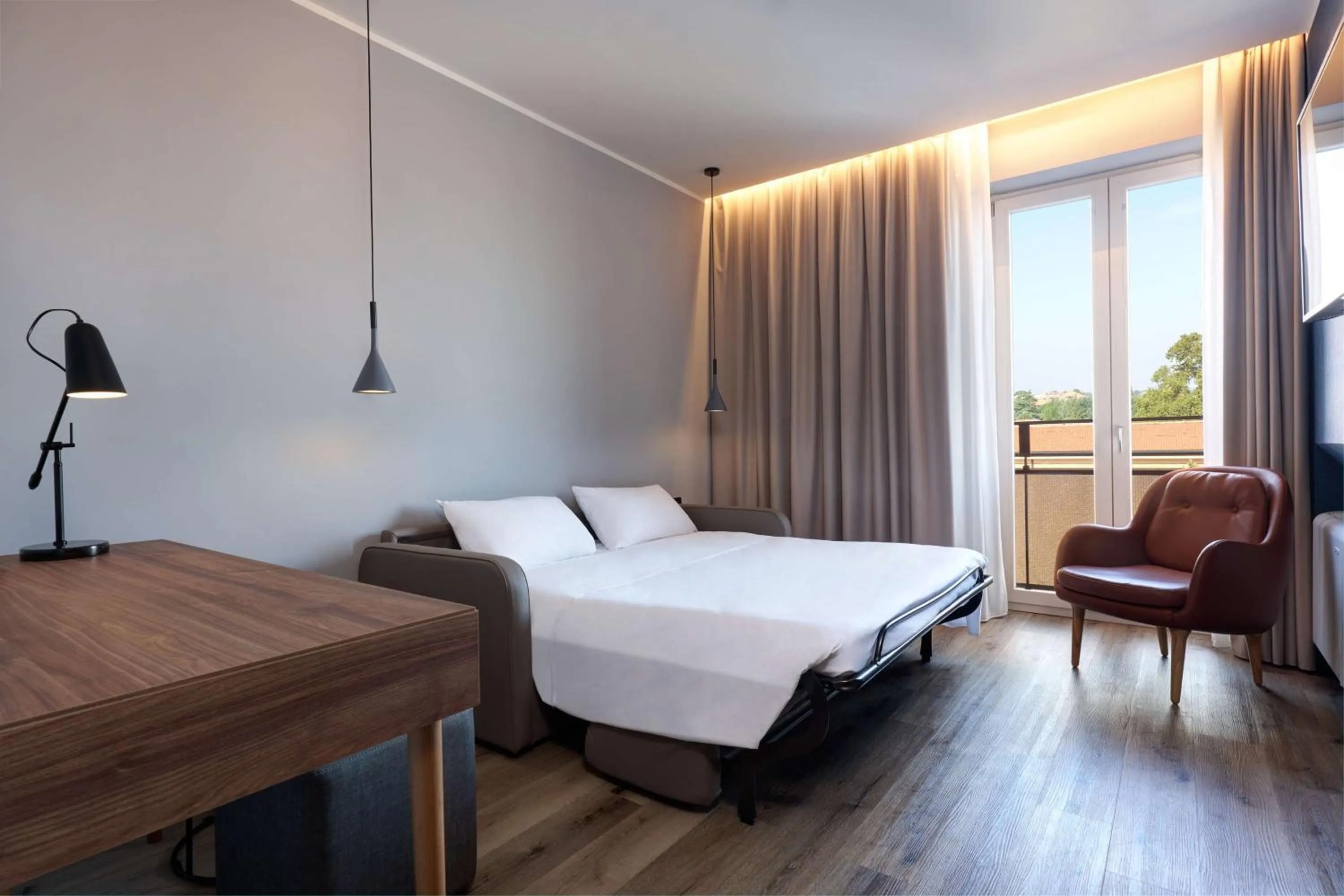 Photo of the whole room, Bed in Radisson Hotel Ferrara