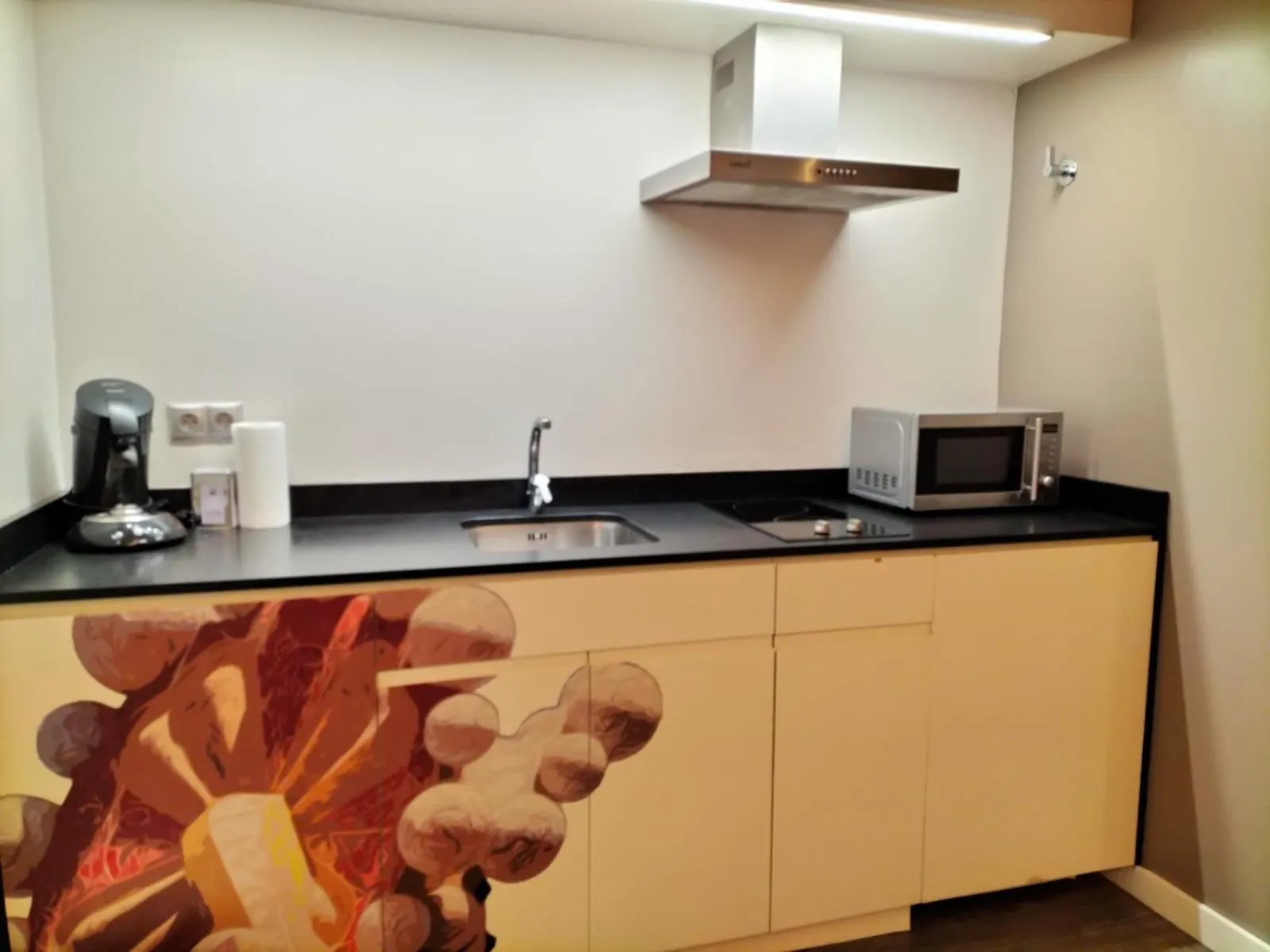 Communal kitchen in Montserrat Apartments by gaiarooms