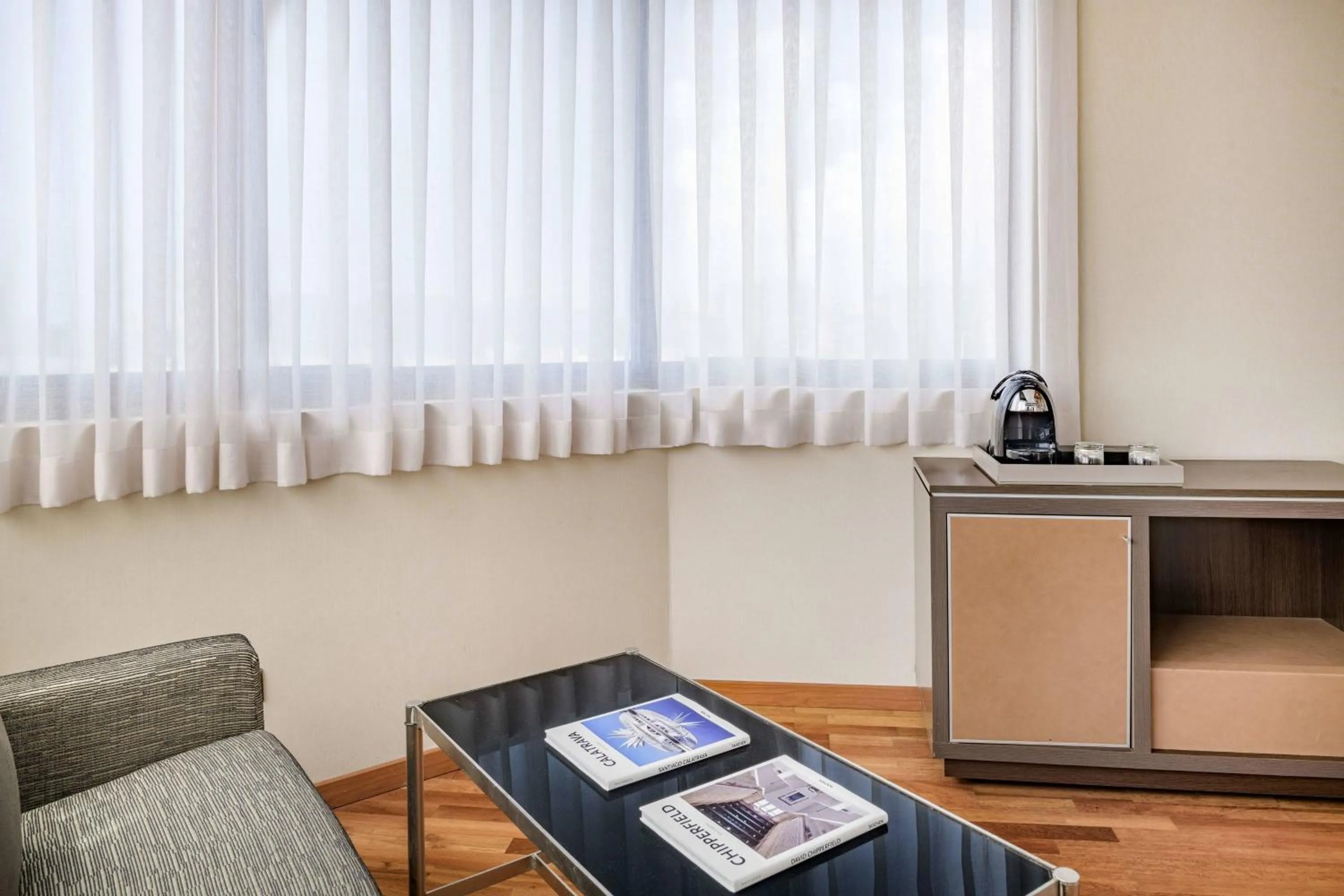 Living room in AC Hotel Genova by Marriott