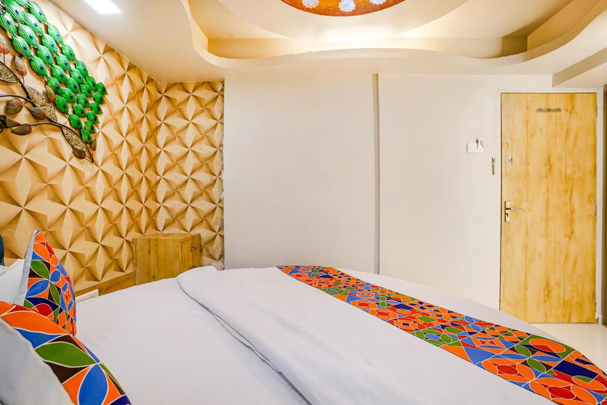 Bed in FabHotel Amber Corp Inn