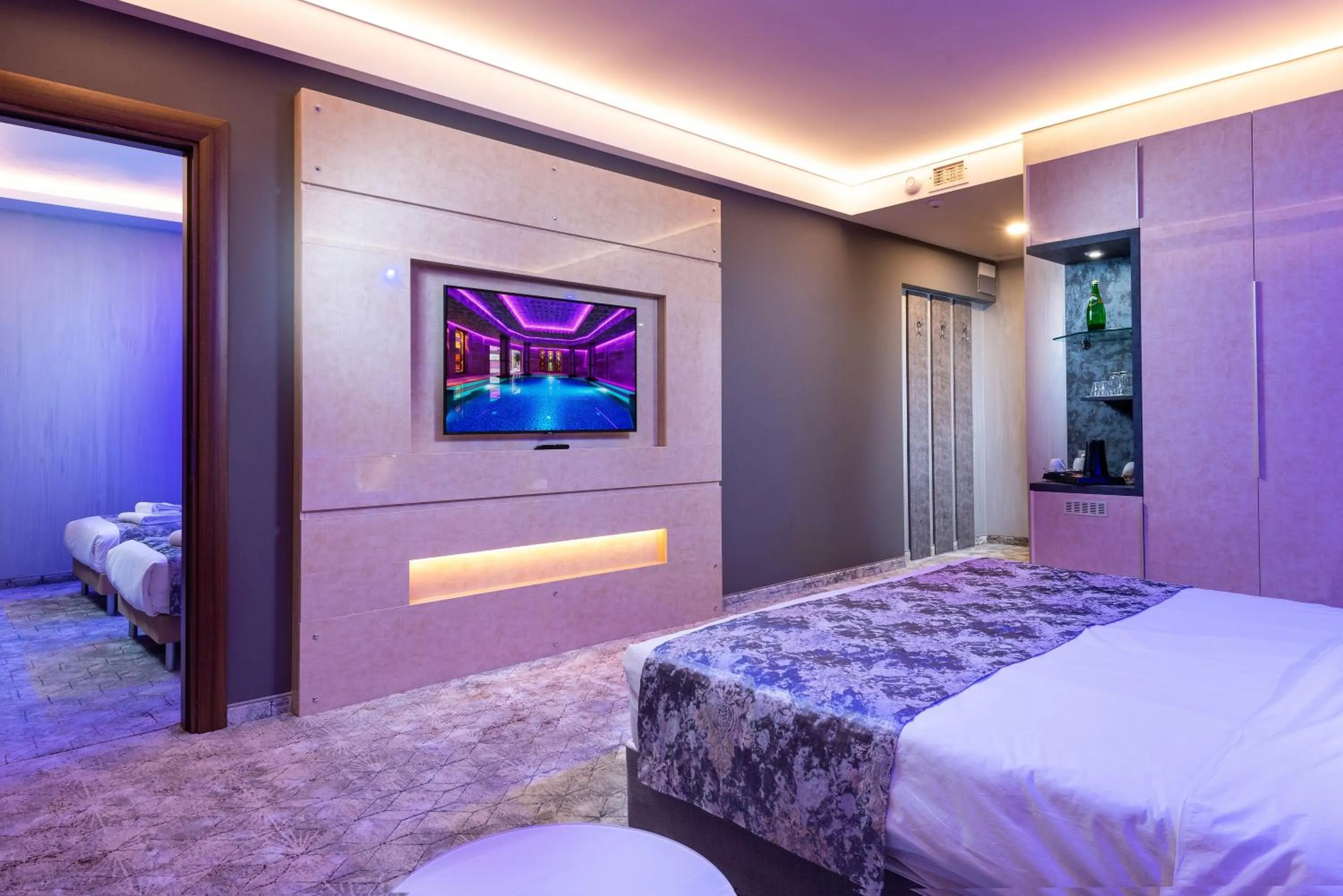 Communal lounge/ TV room, Bed in National Palace Wine & Spa Hotel