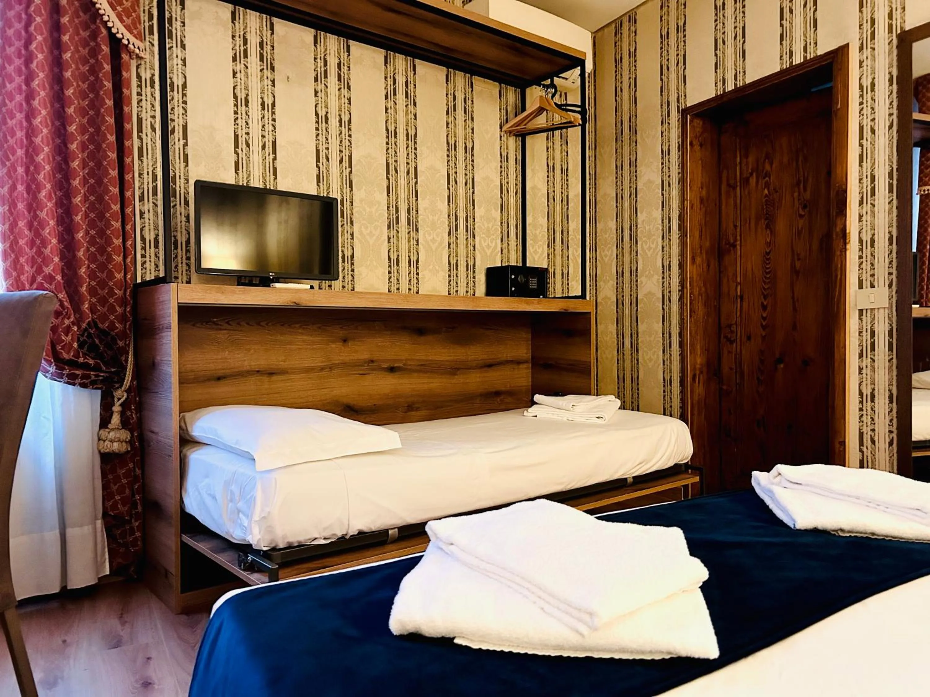 Bed in Hotel al Graspo de Ua