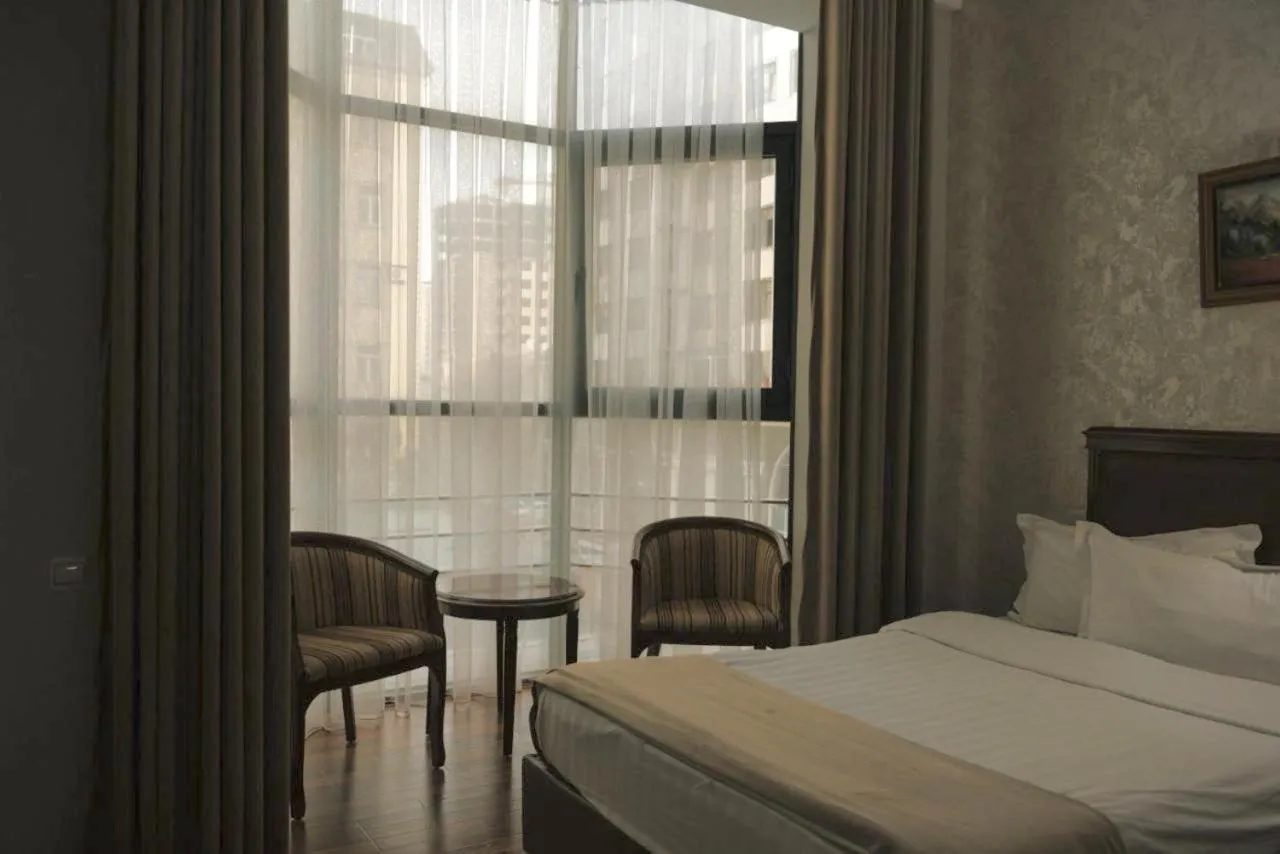 Bed in Asia Grand Hotel