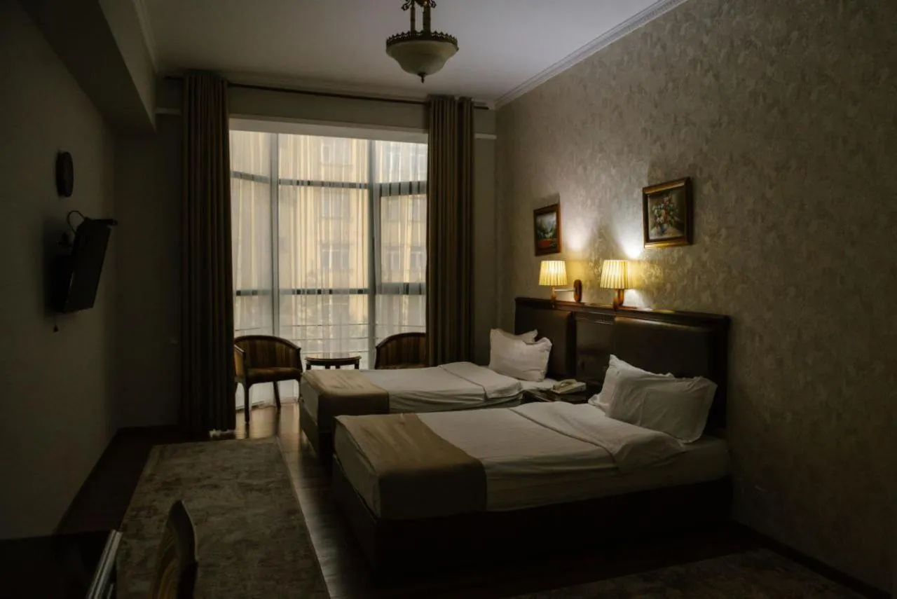 Bed in Asia Grand Hotel