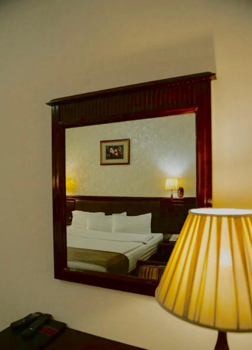 Bed in Asia Grand Hotel