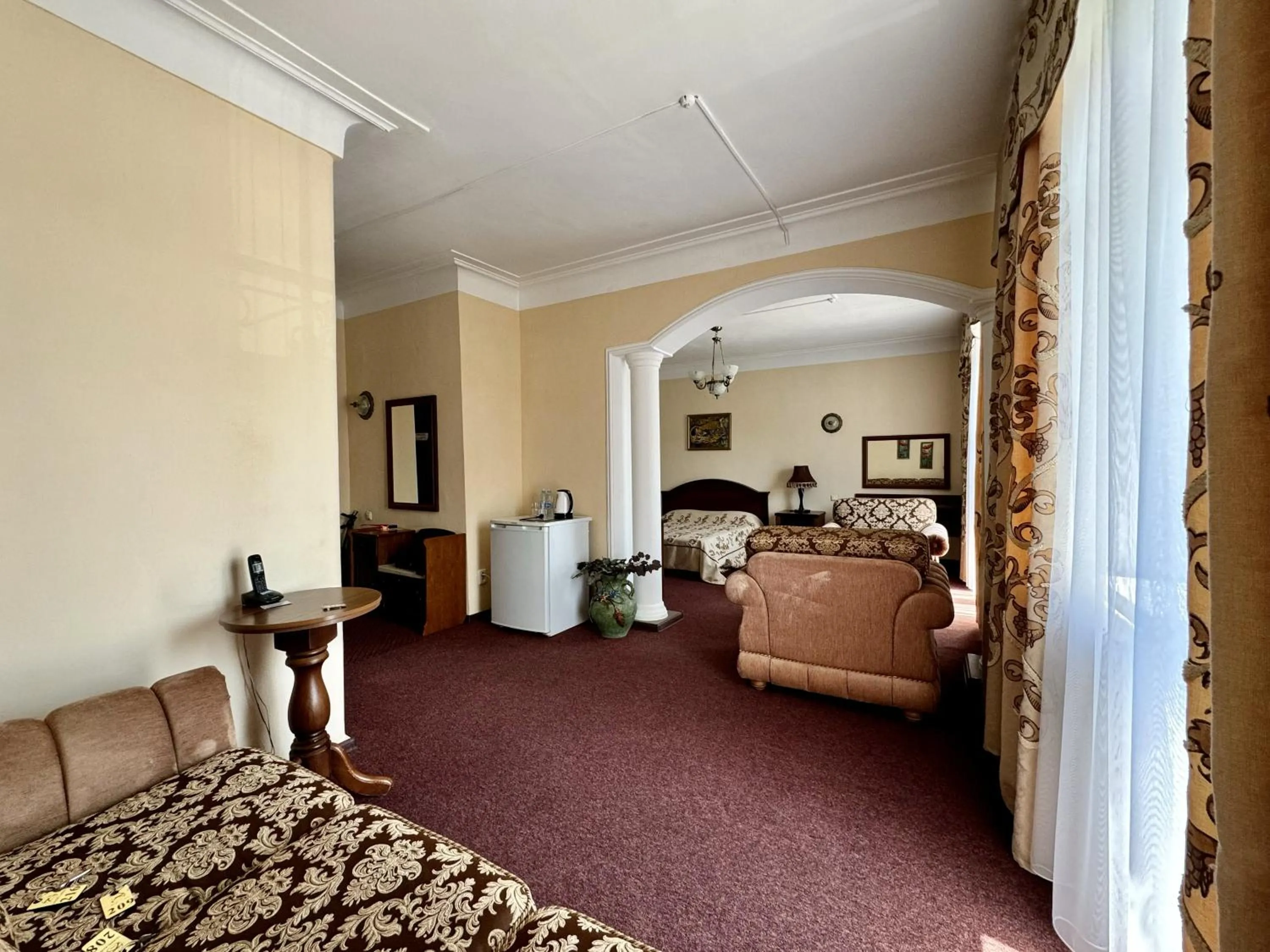 Living room, Bed in Hotel Zhambyl