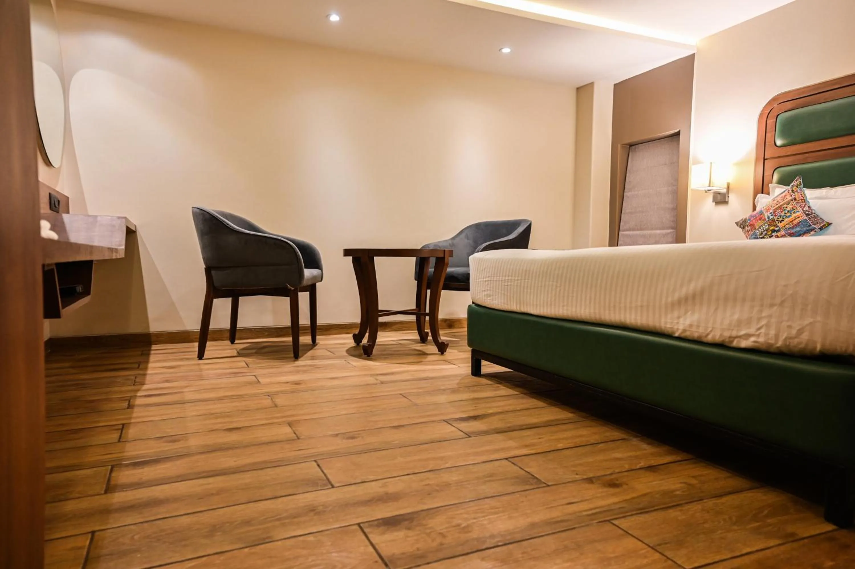 Photo of the whole room, Bed in Suvidha Suites