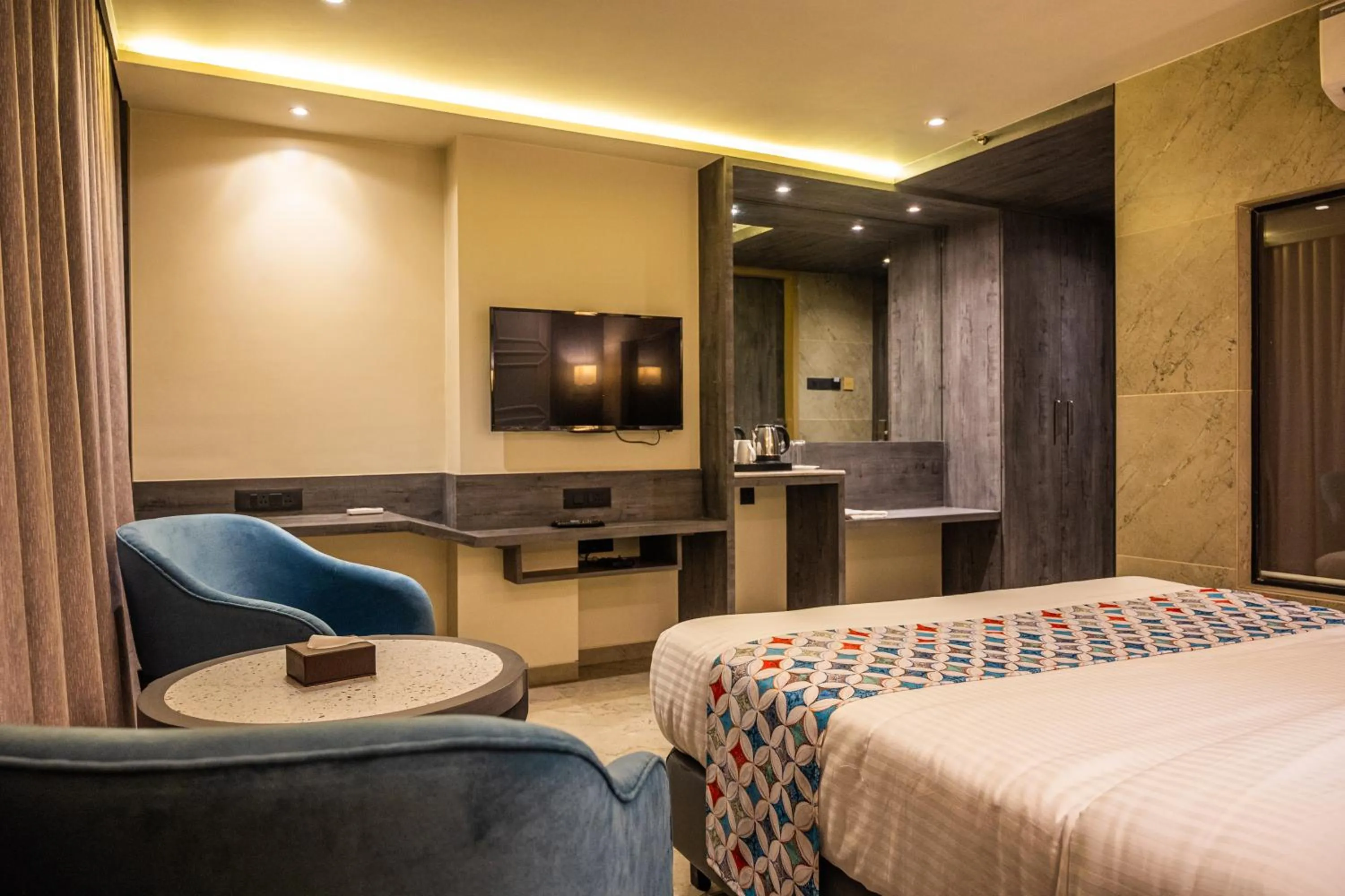 Photo of the whole room, Bed in Suvidha Suites