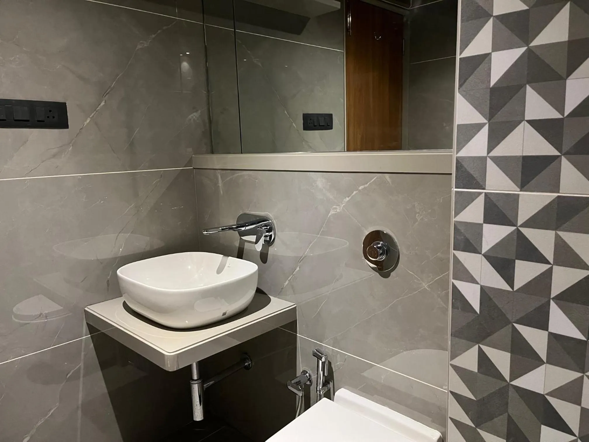 Bathroom in Suvidha Suites