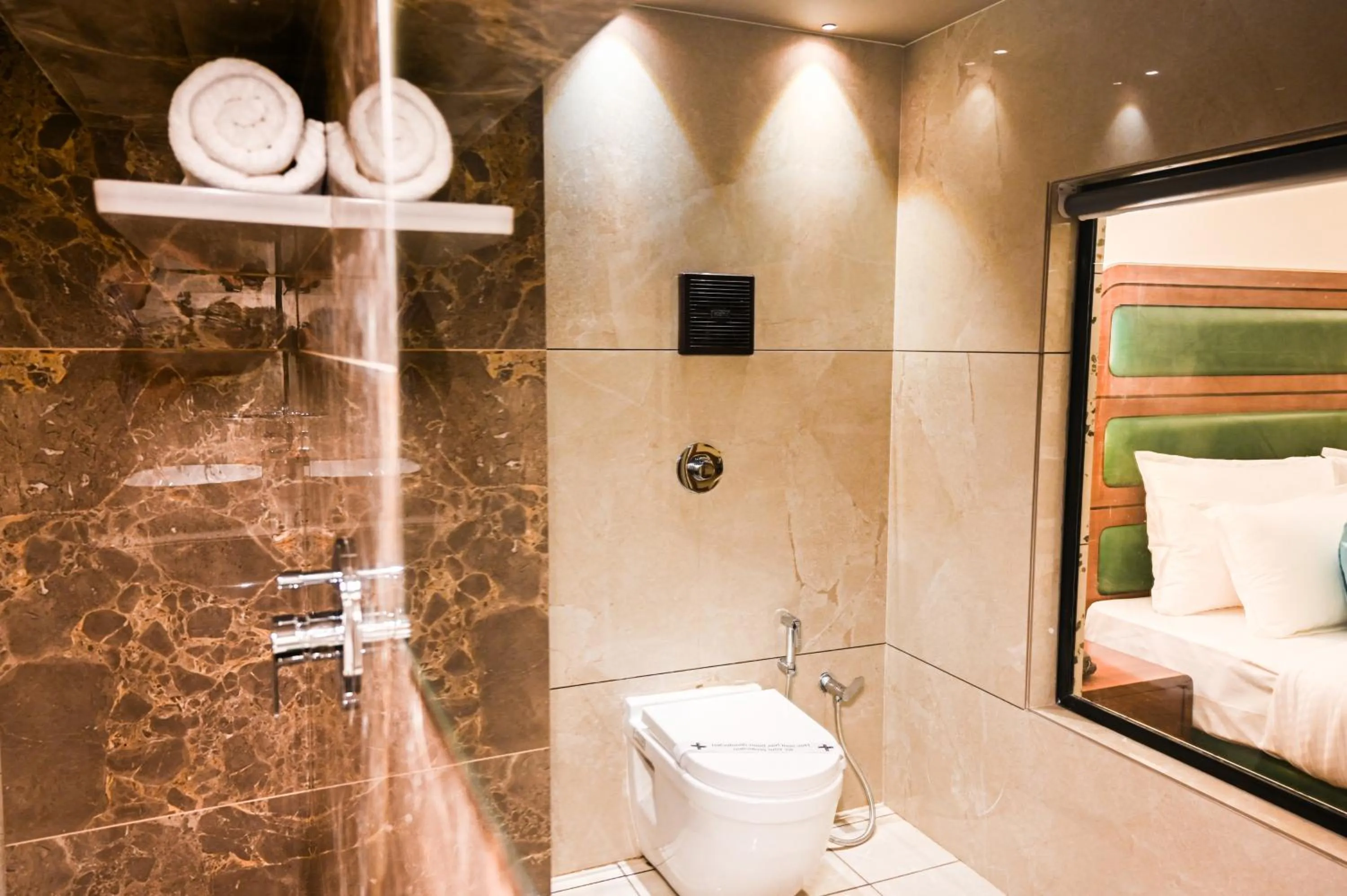 Bathroom in Suvidha Suites